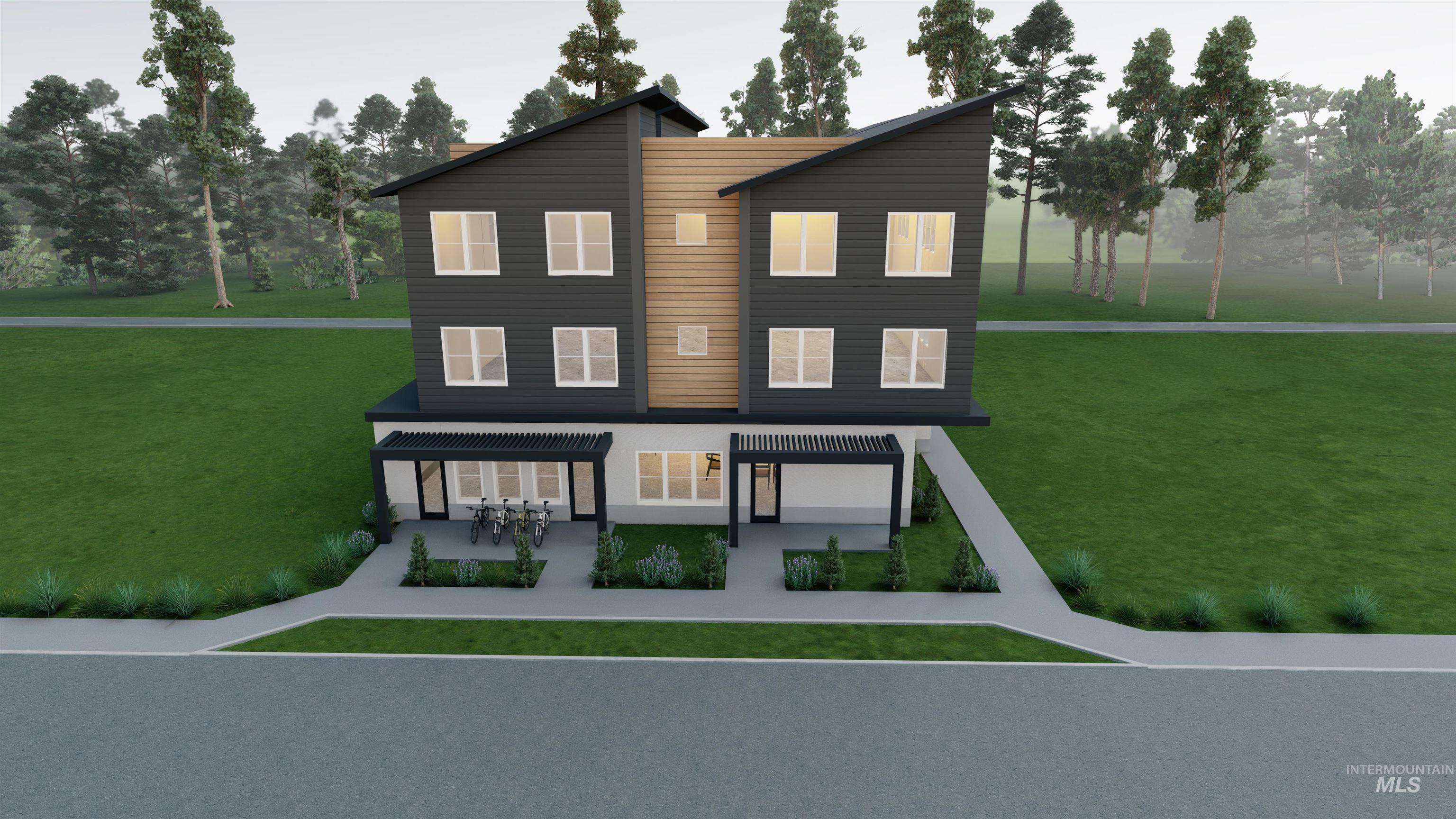 Rear view of property with a lawn