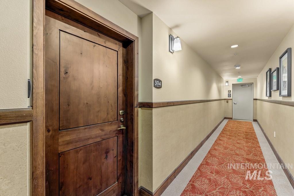 Hallway featuring baseboards and recessed lighting