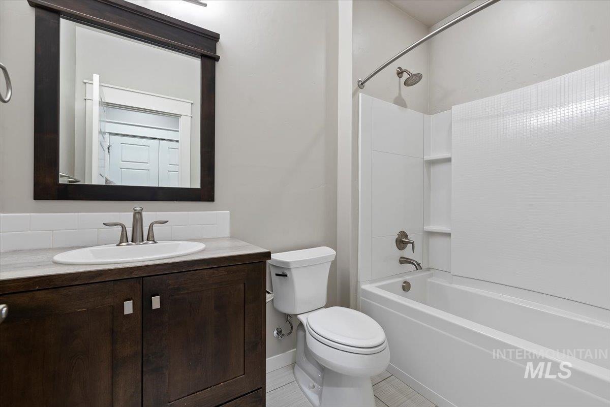 Bathroom featuring shower / bath combination and vanity