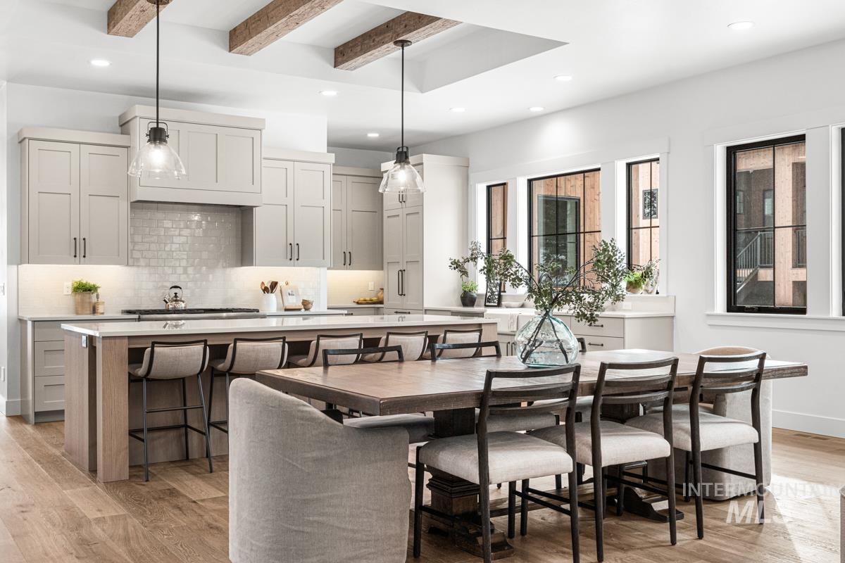 Dining room featuring recessed lighting, beam ceiling, and light wood-style flooring