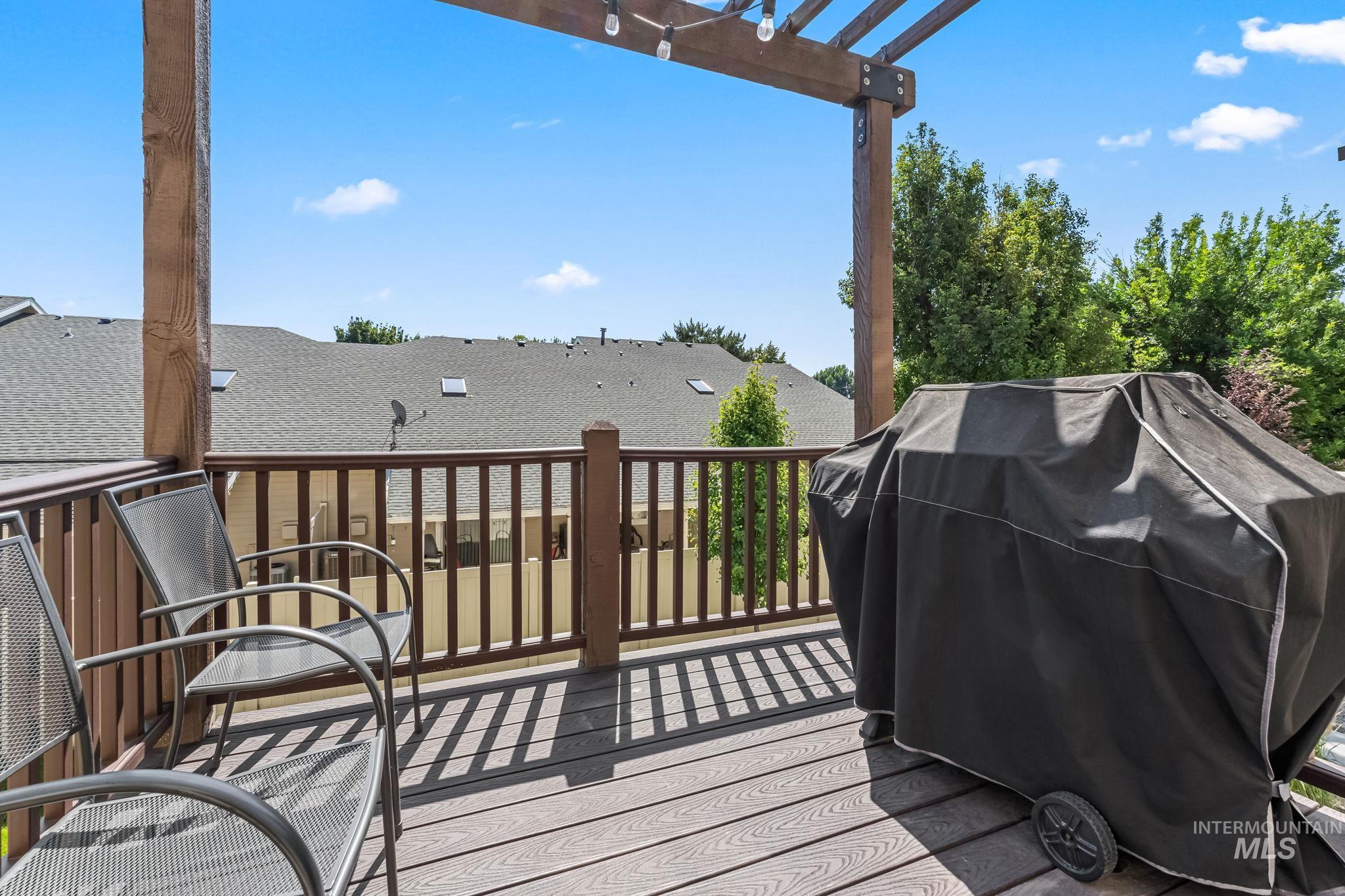 Deck with a pergola and grilling area