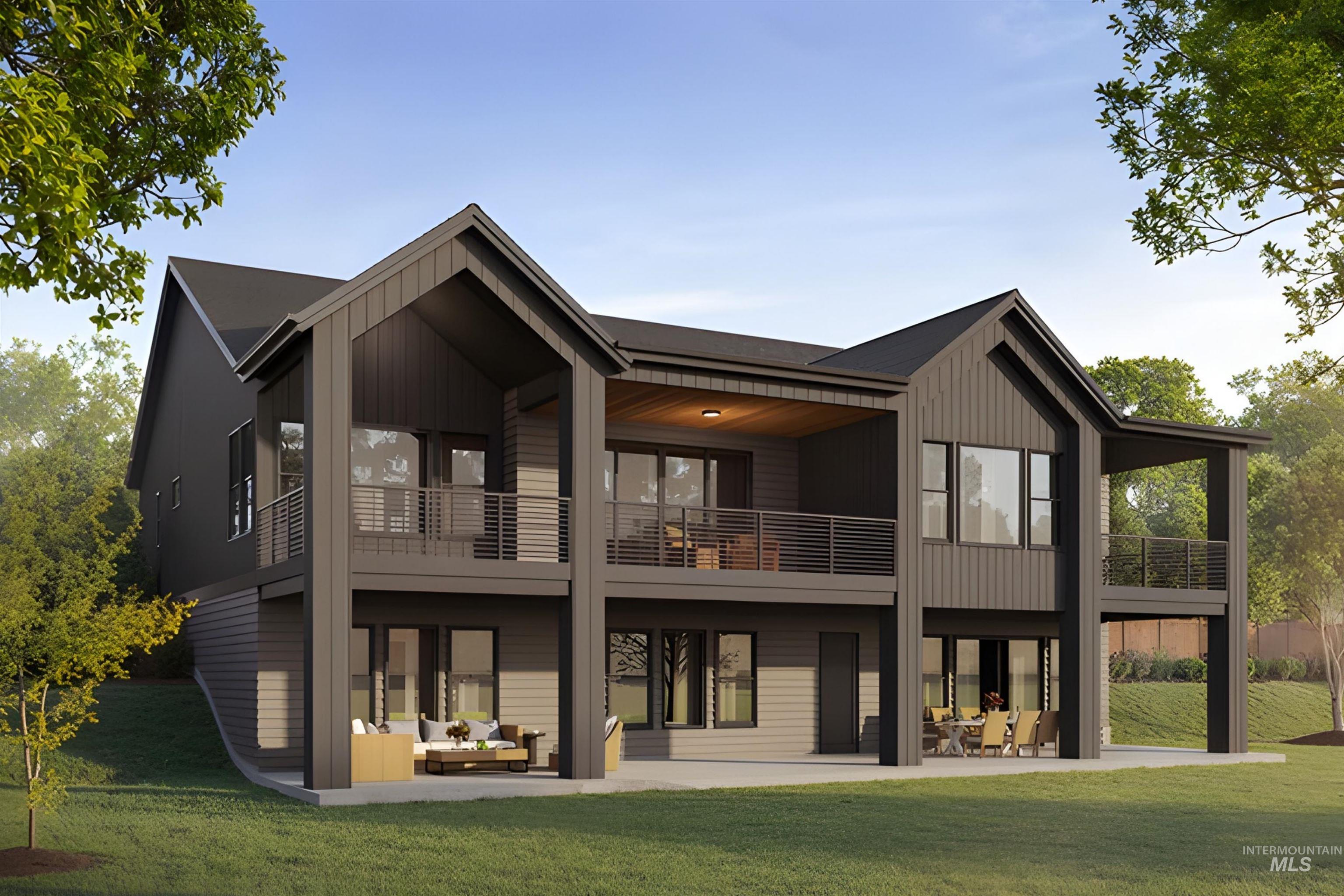 Rear view of house featuring a yard, a patio area, board and batten siding, and an outdoor living space