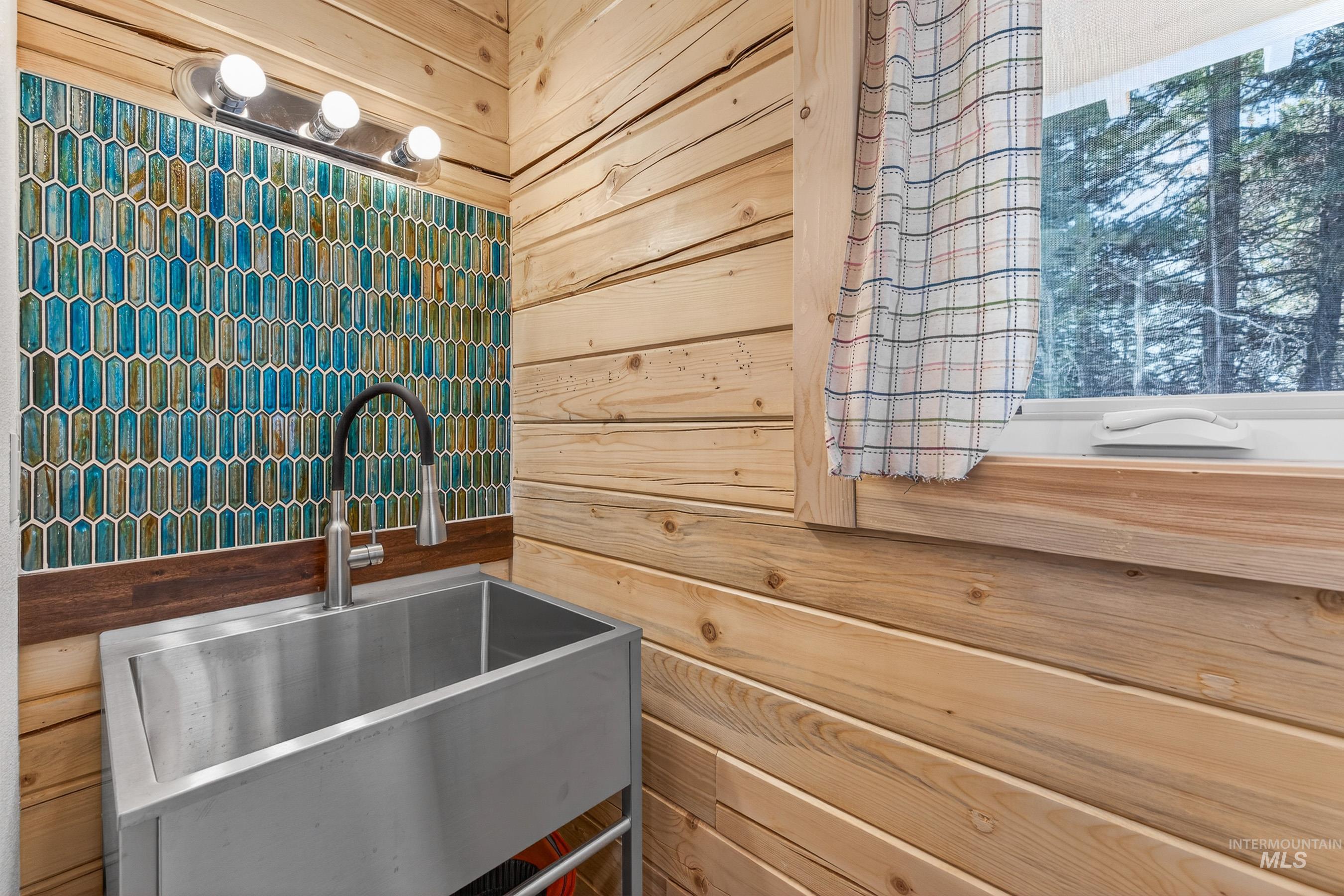 Industrial sink, beautiful tile work in the powder bath