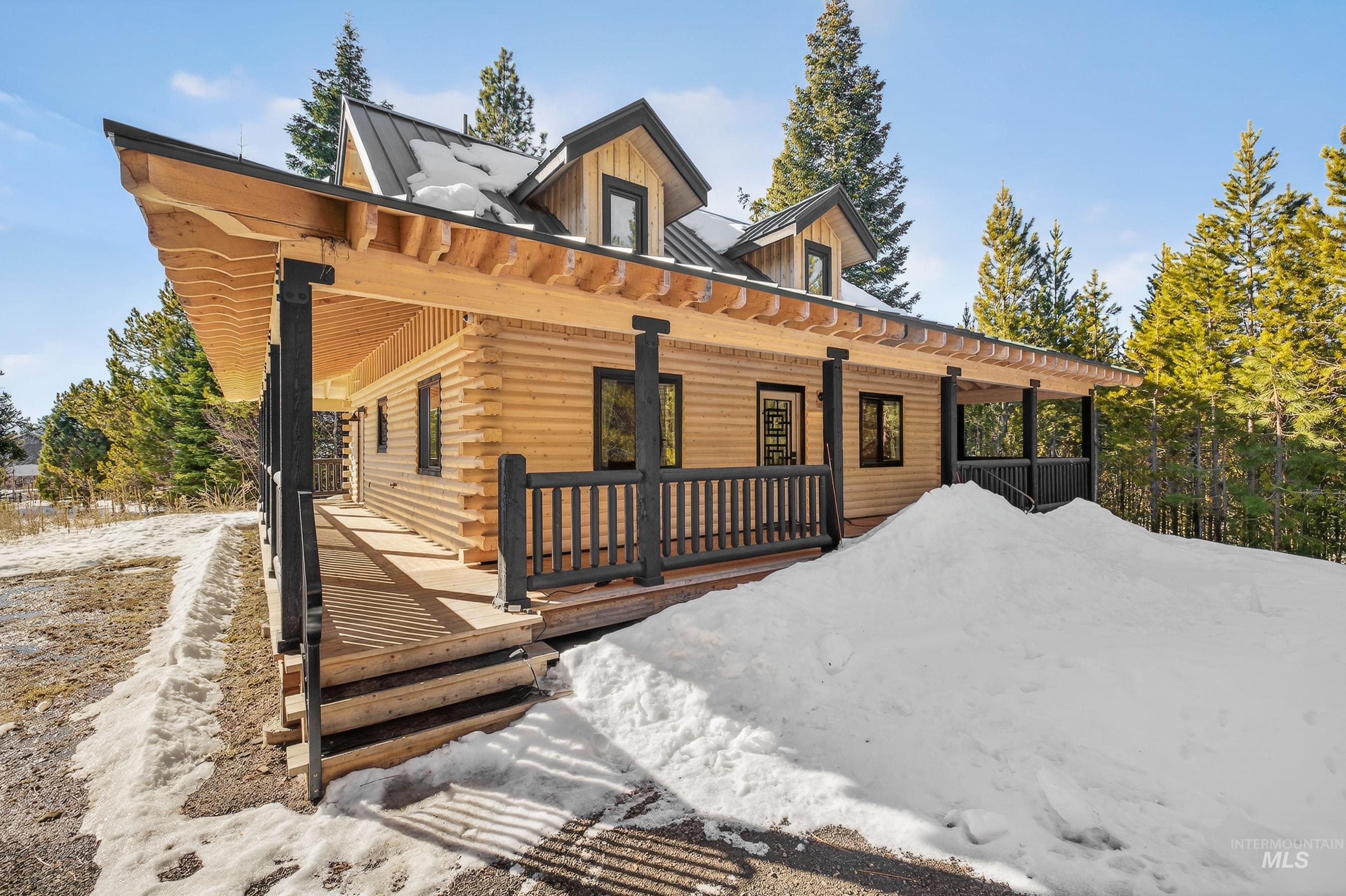 Home sits on a rim above the road with beautiful views down valley and of the mountains