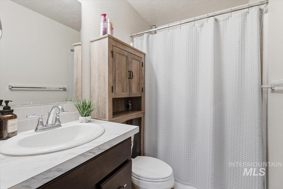 Bathroom with vanity and a shower with curtain