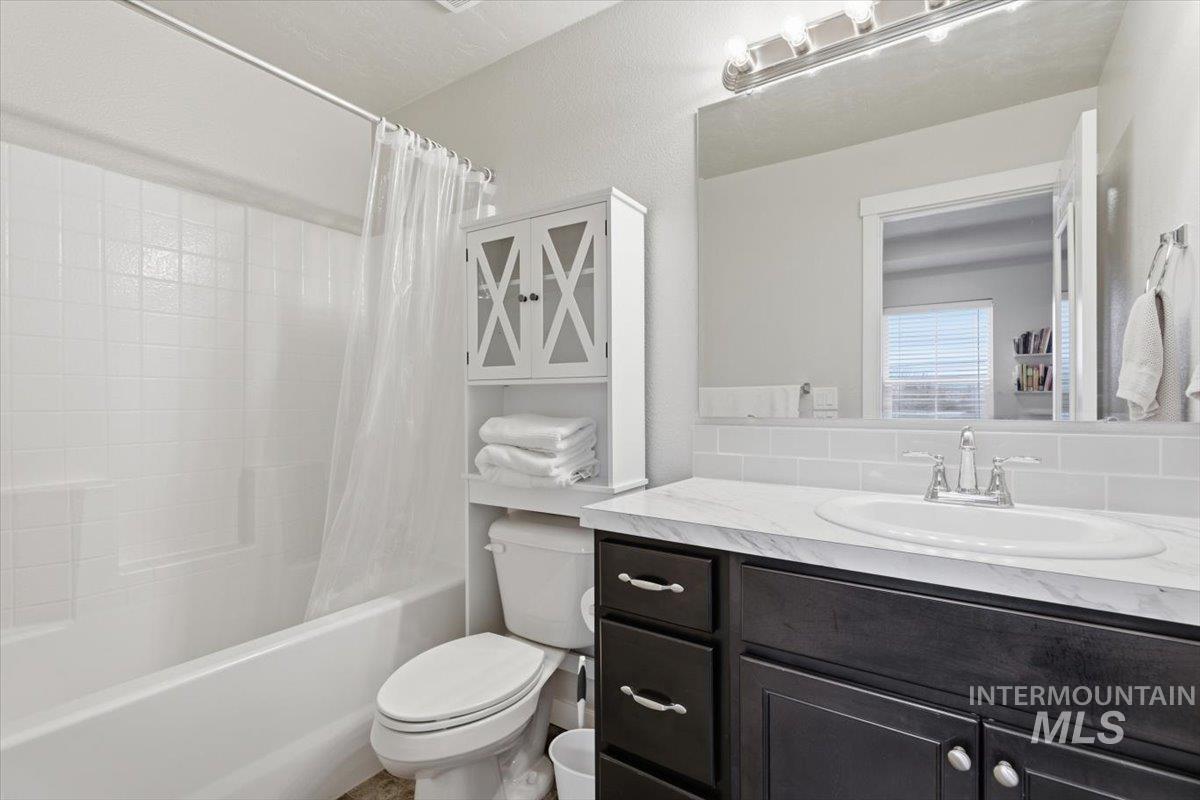Full bathroom featuring vanity and shower / bath combo