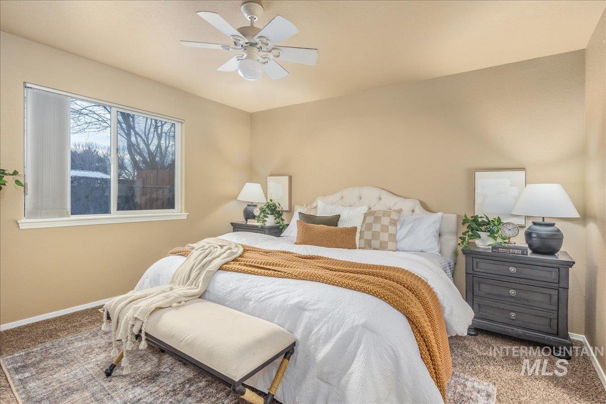 Bedroom with carpet flooring and a ceiling fan