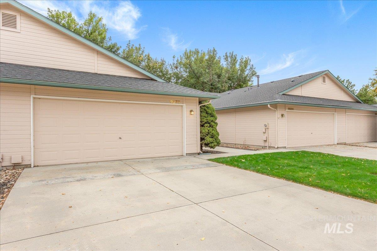 Garage featuring driveway