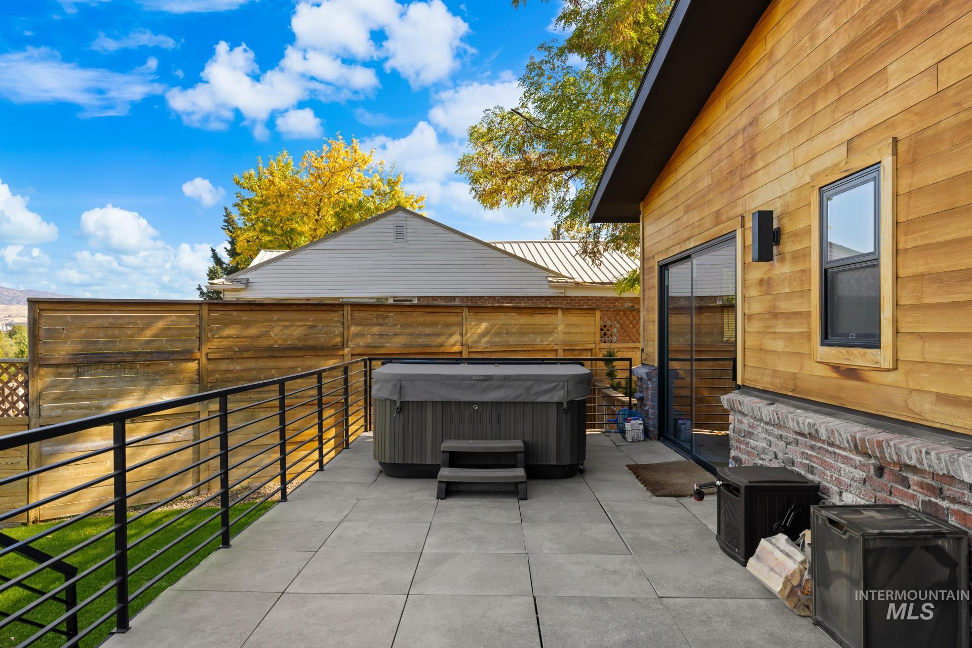 View of patio / terrace with a hot tub