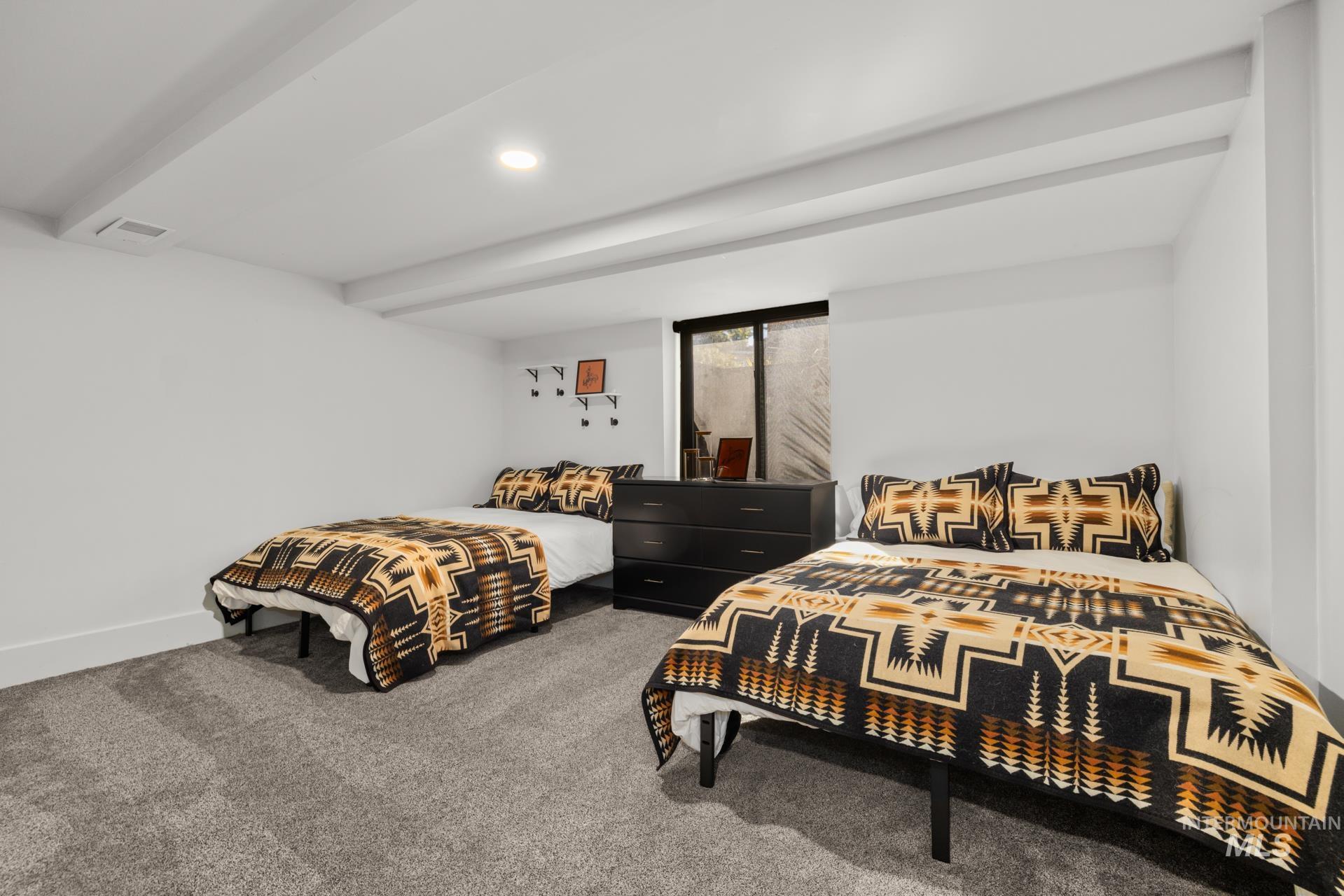 Bedroom with carpet floors and recessed lighting