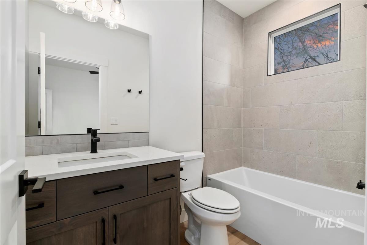 Bathroom featuring vanity and shower / bath combination