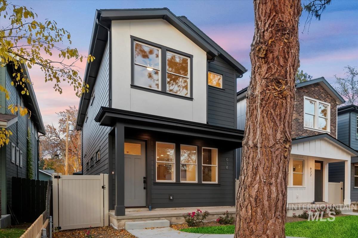 Contemporary house with a gate and covered porch