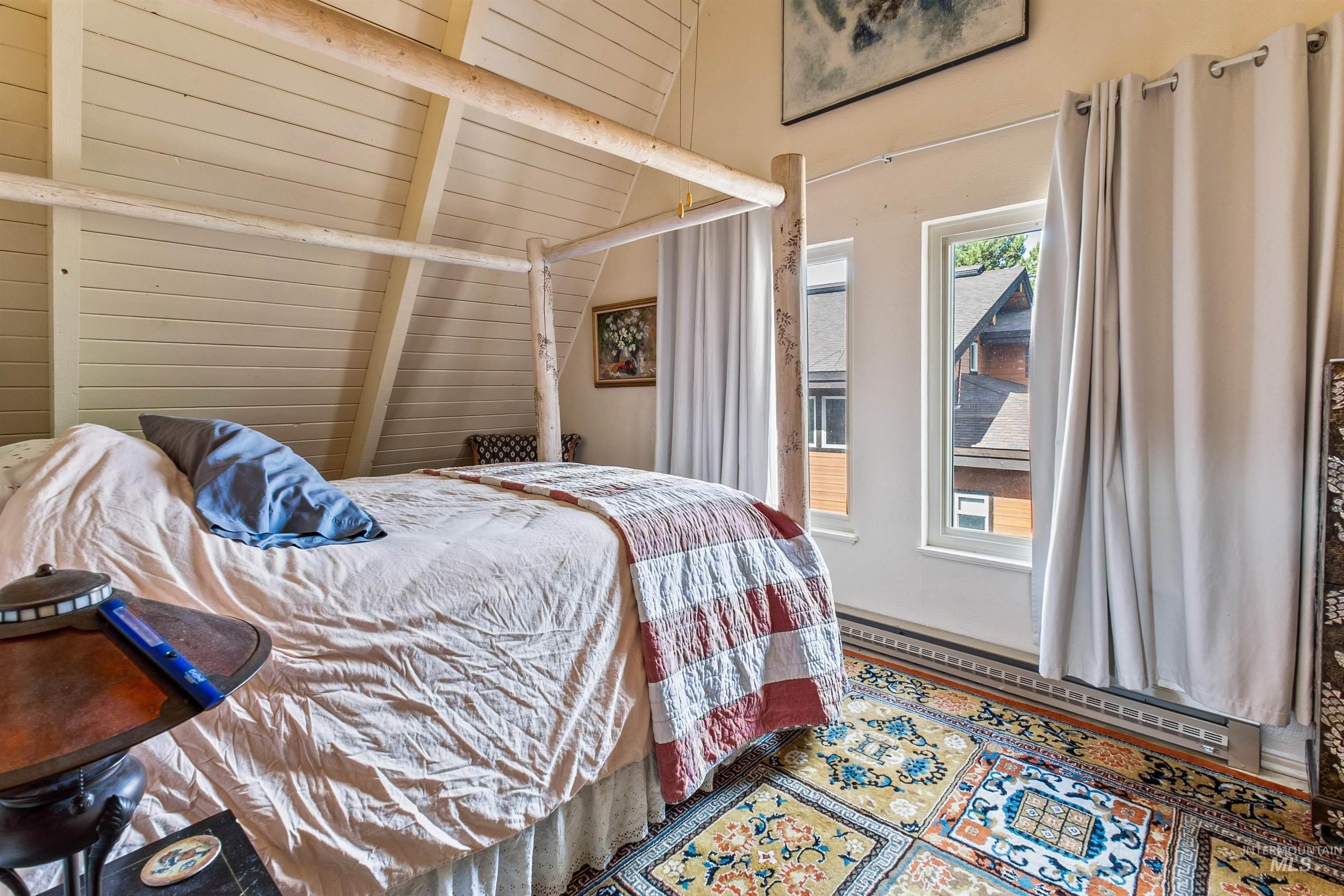 Bedroom featuring baseboard heating