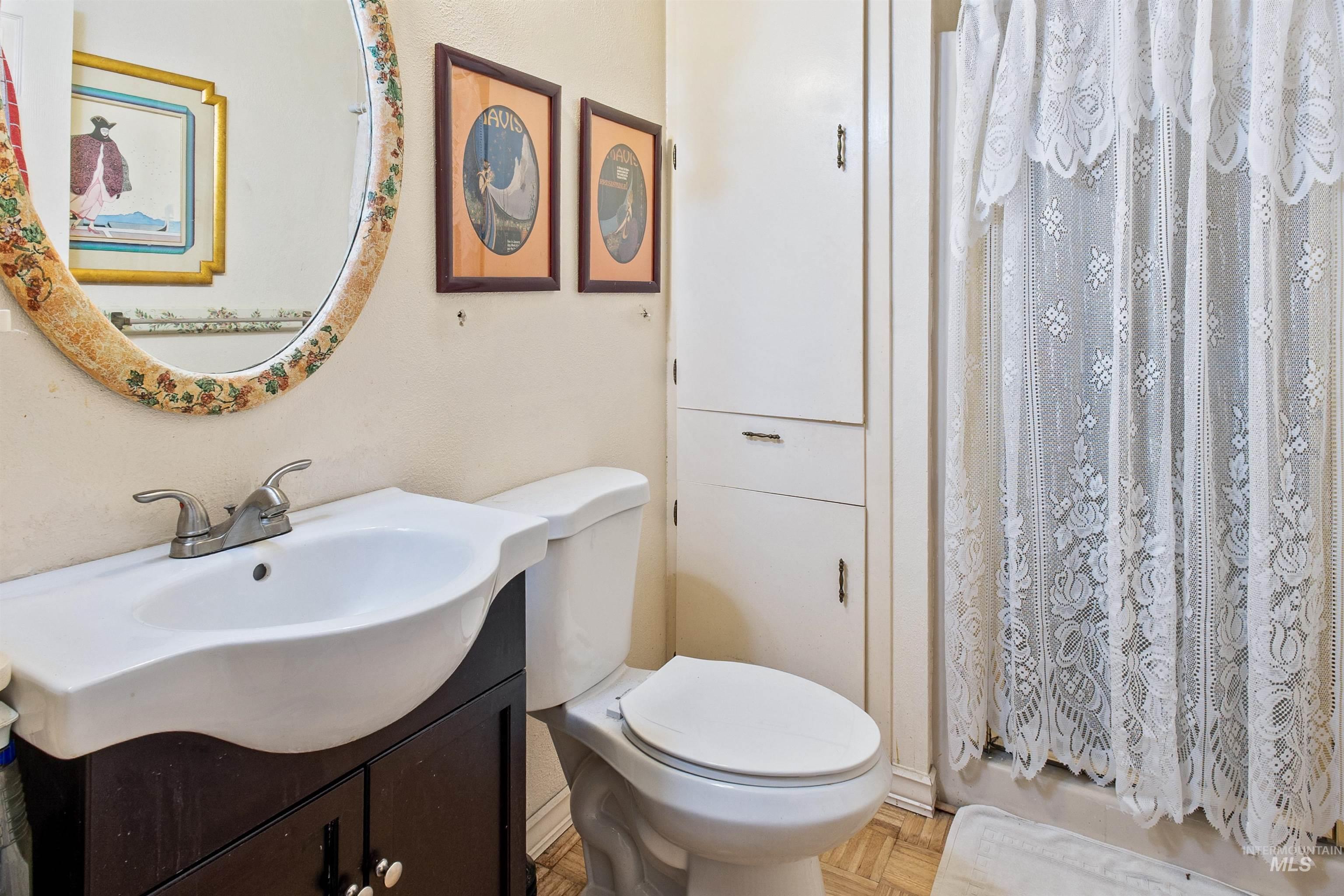 Full bath featuring vanity and a shower with curtain