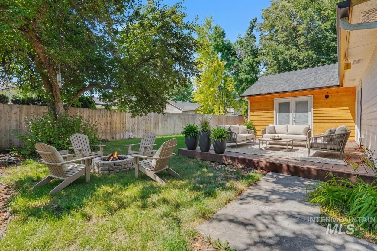 Expansive outdoor living space featuring a wood deck. *Virtually Staged photo*