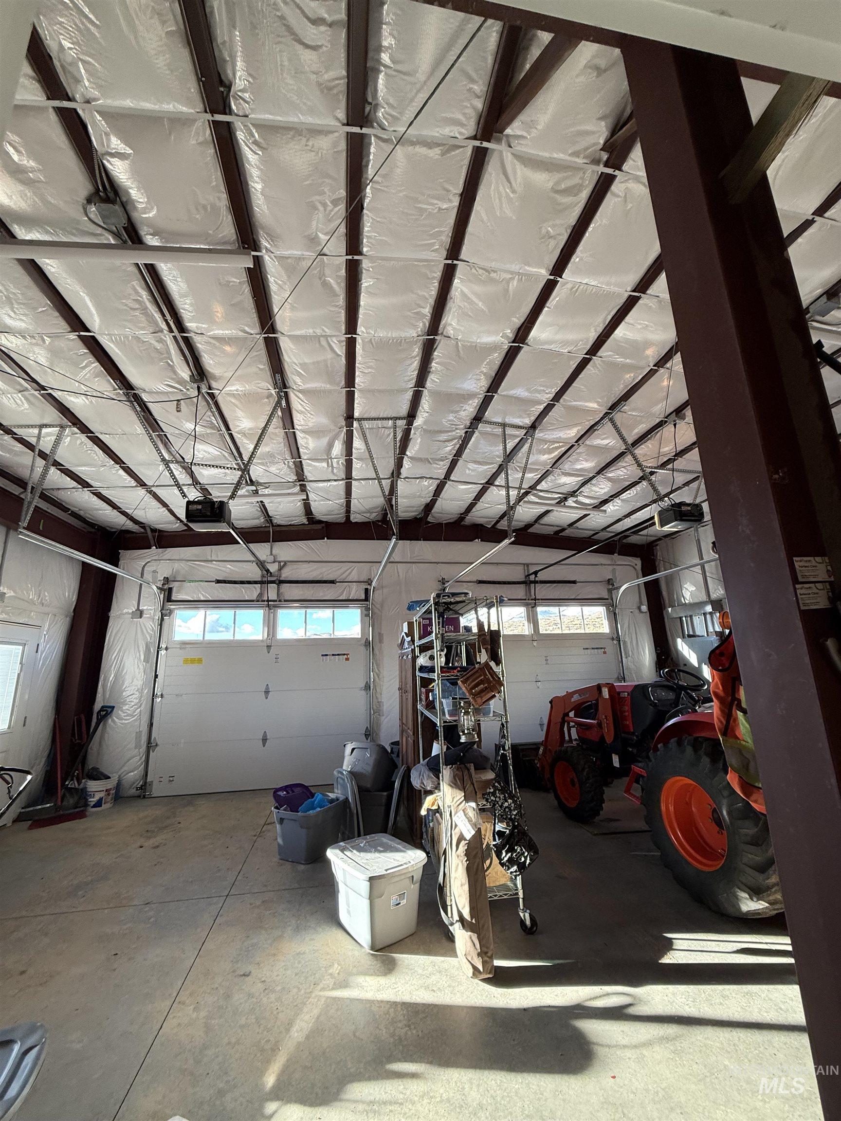 Insulated garage featuring garage door openers