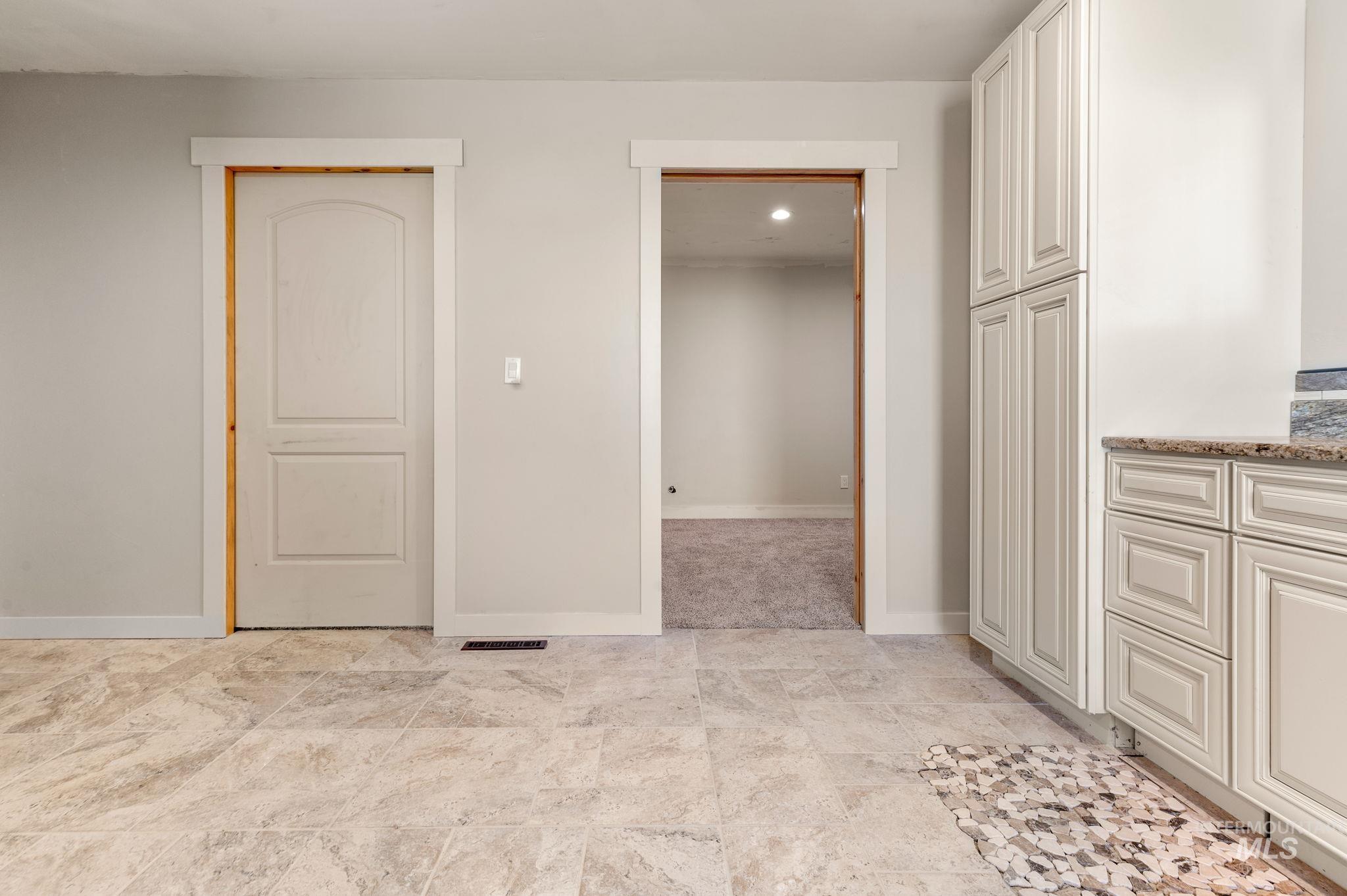 Unfurnished bedroom with baseboards and recessed lighting