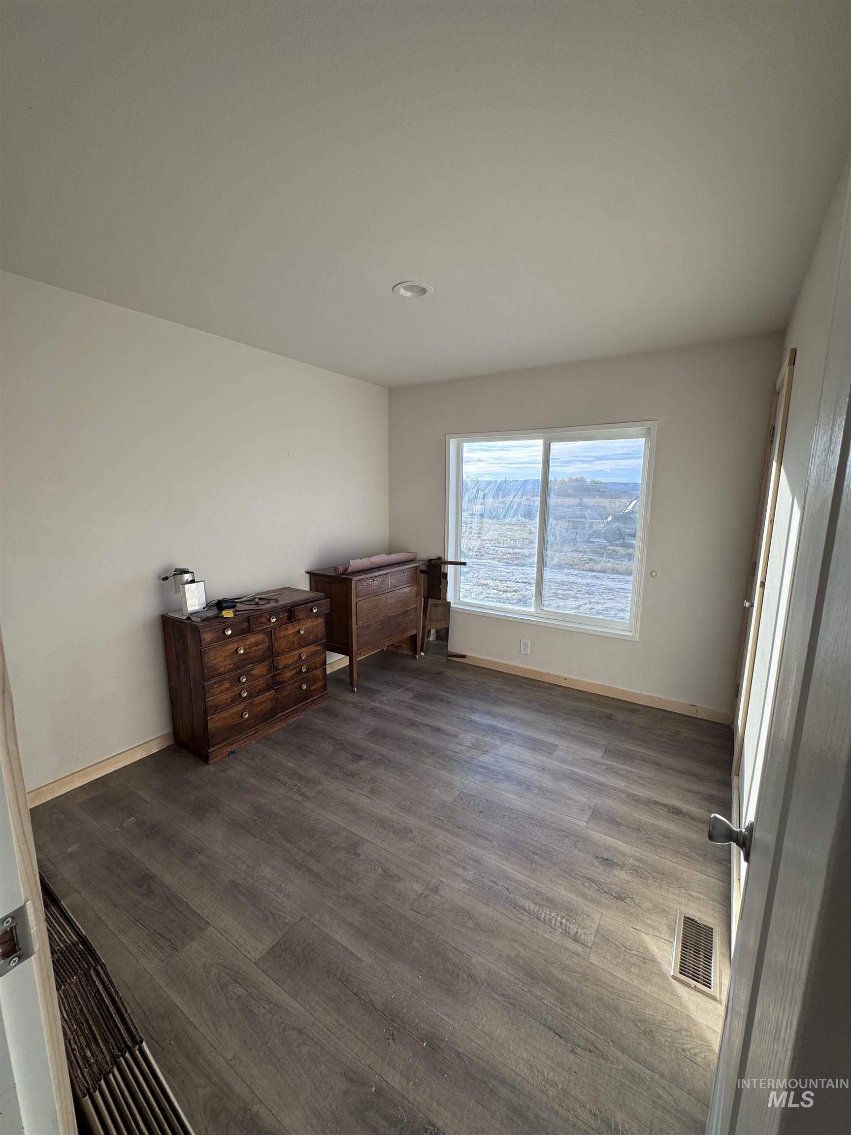 Bedroom featuring wood finished floors and recessed lighting