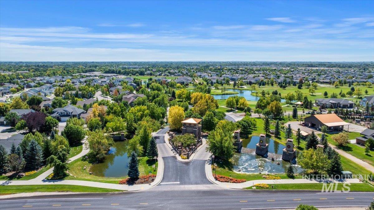 Aerial perspective of suburban area featuring a large body of water
