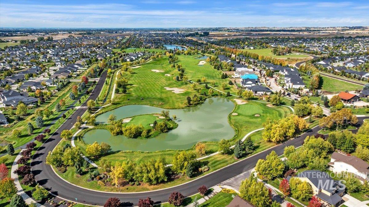 Aerial overview of property's location with a large body of water and nearby suburban area