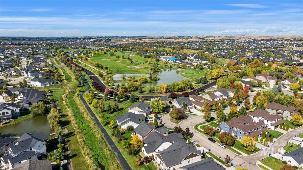 Aerial overview of property's location with nearby suburban area and a nearby body of water