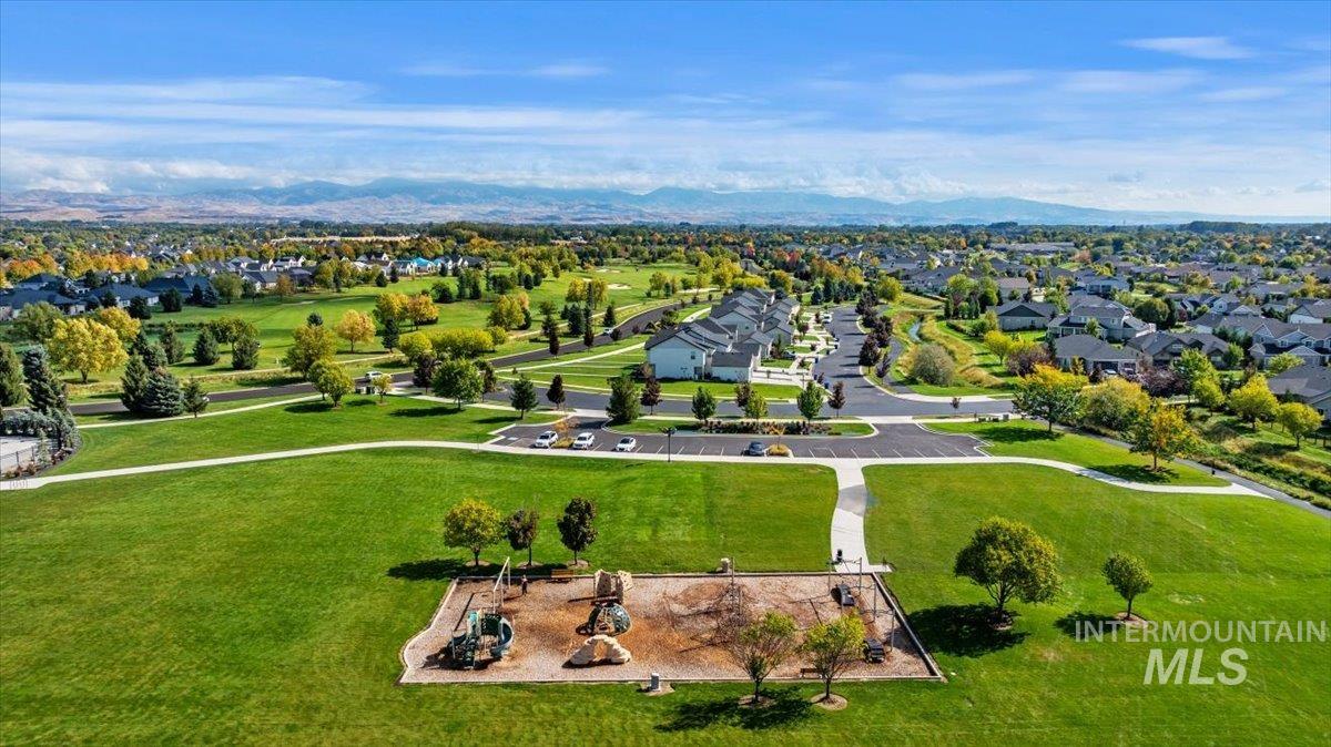 Aerial perspective of suburban area with a mountain backdrop