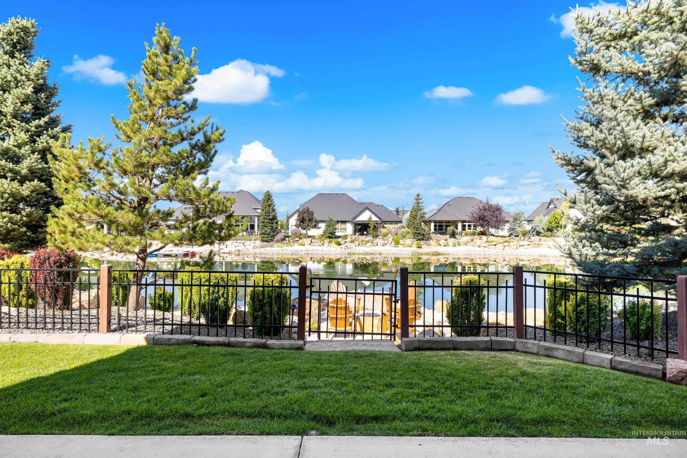 View of yard featuring a water view and a residential view