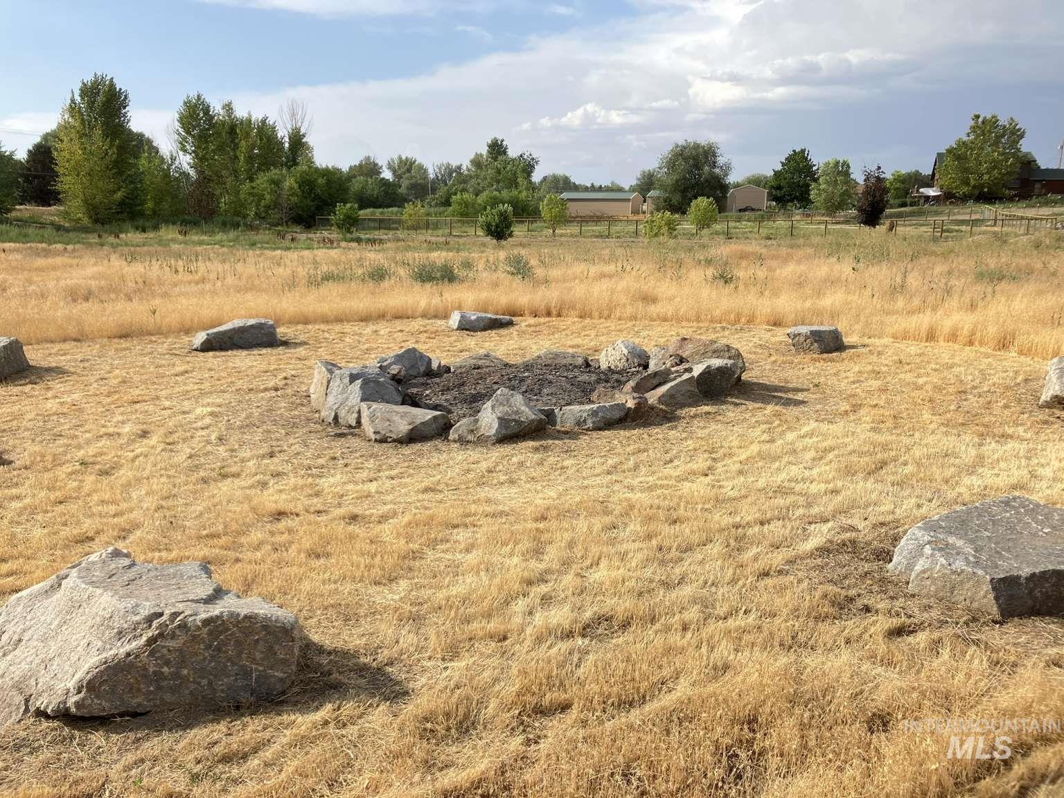 View of yard with a rural view