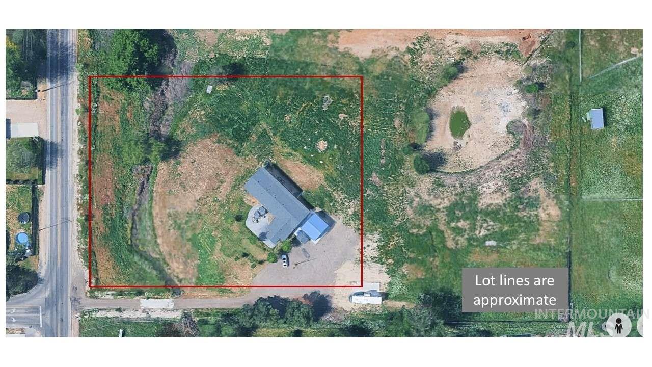 Aerial view of property and surrounding area with property boundaries highlighted