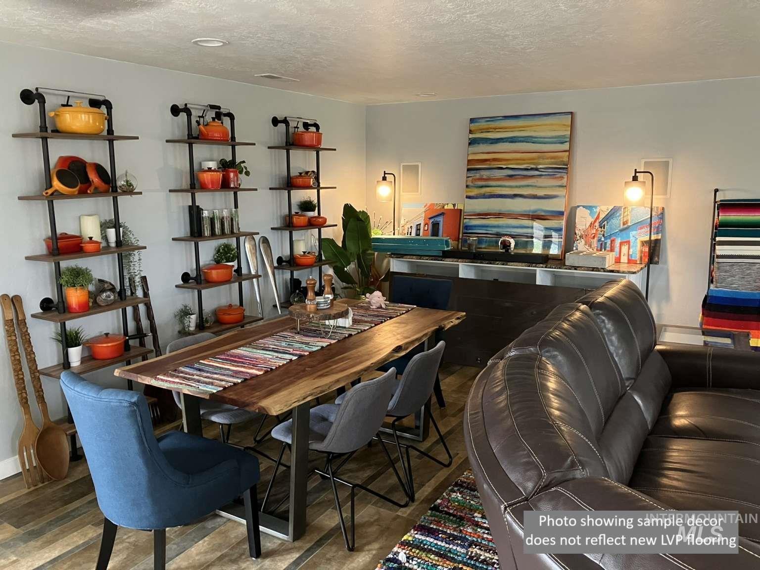 Dining room featuring a textured ceiling and wood finished floors