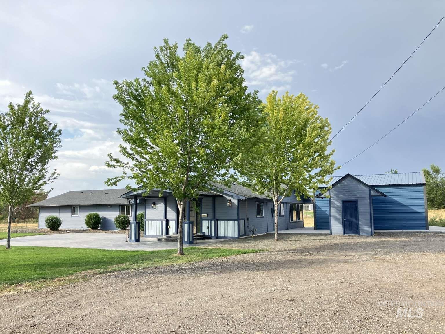 Ranch-style house featuring an outdoor structure