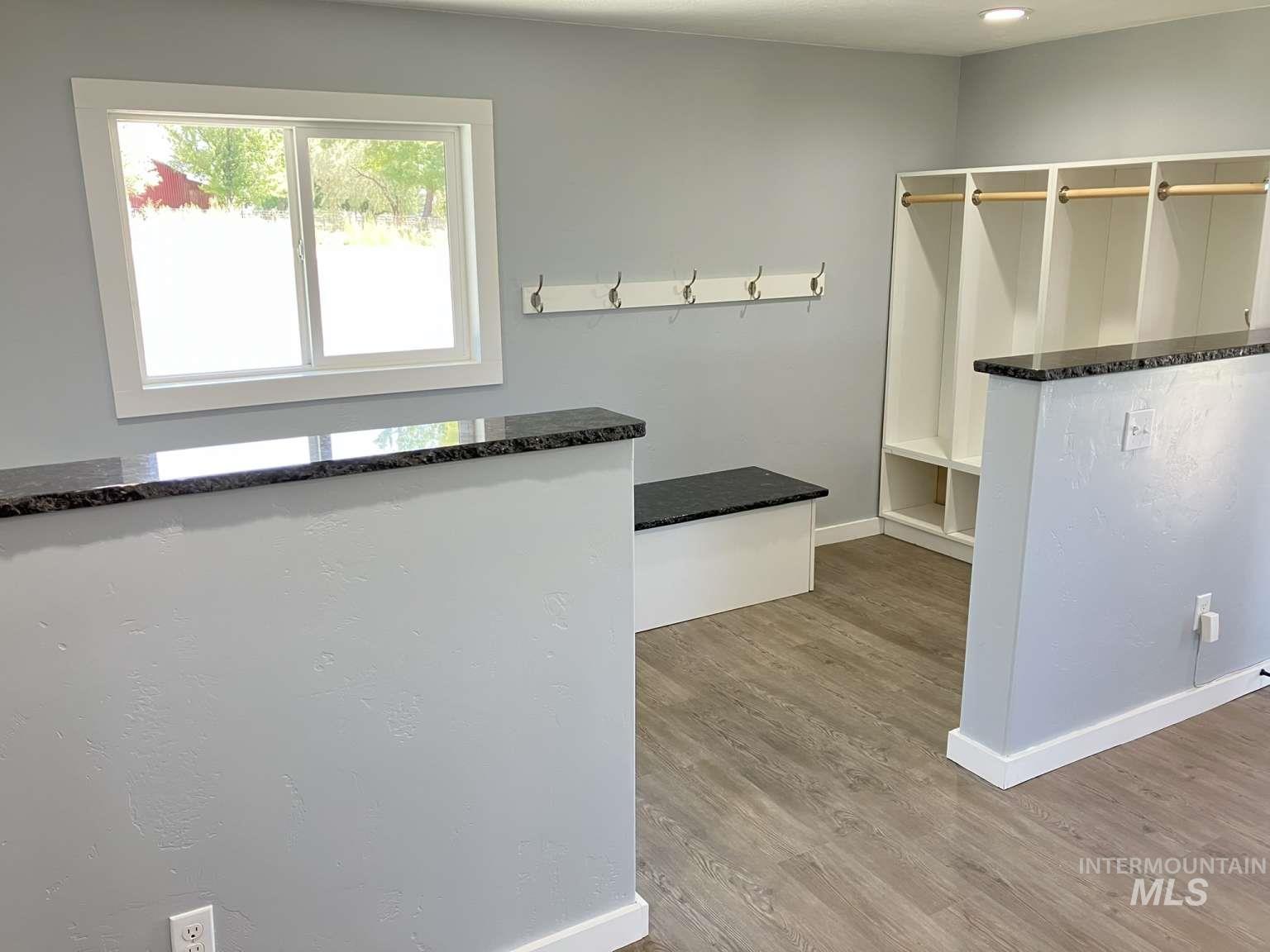 Walk in closet featuring wood finished floors