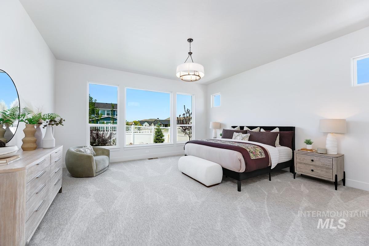 Bedroom with light colored carpet