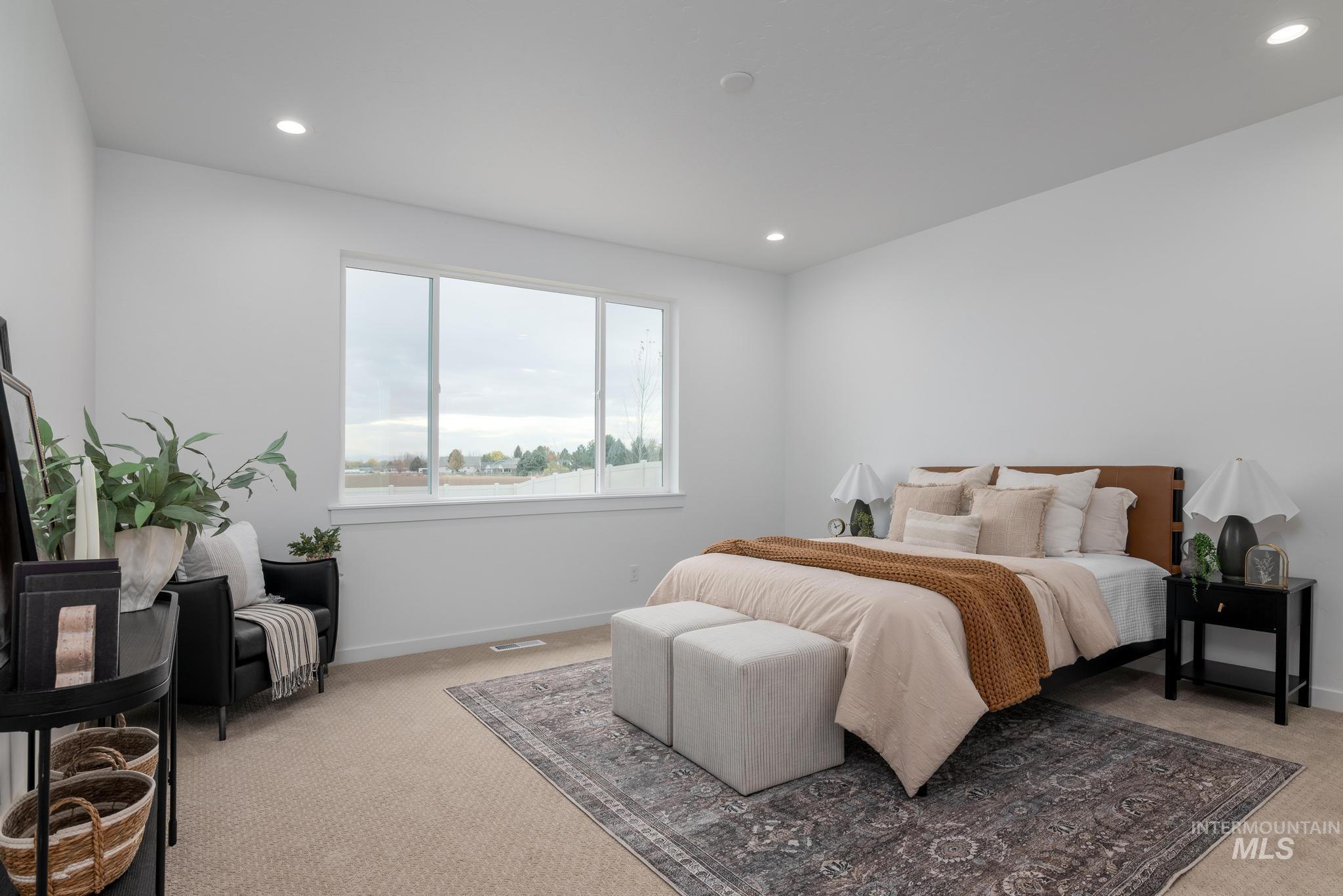 Carpeted bedroom featuring recessed lighting and baseboards