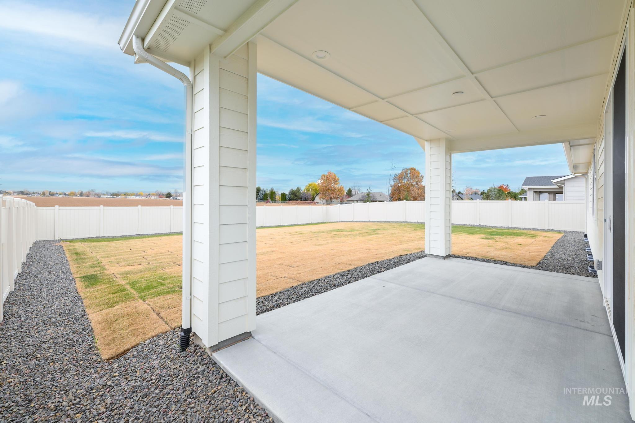Fenced backyard featuring a patio