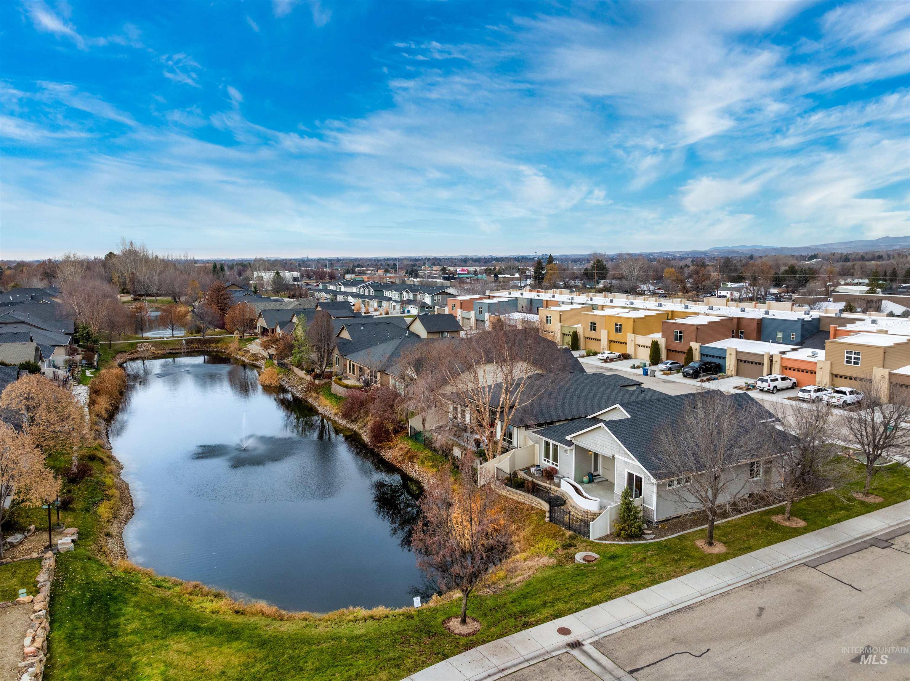 Aerial perspective of suburban area with a large body of water