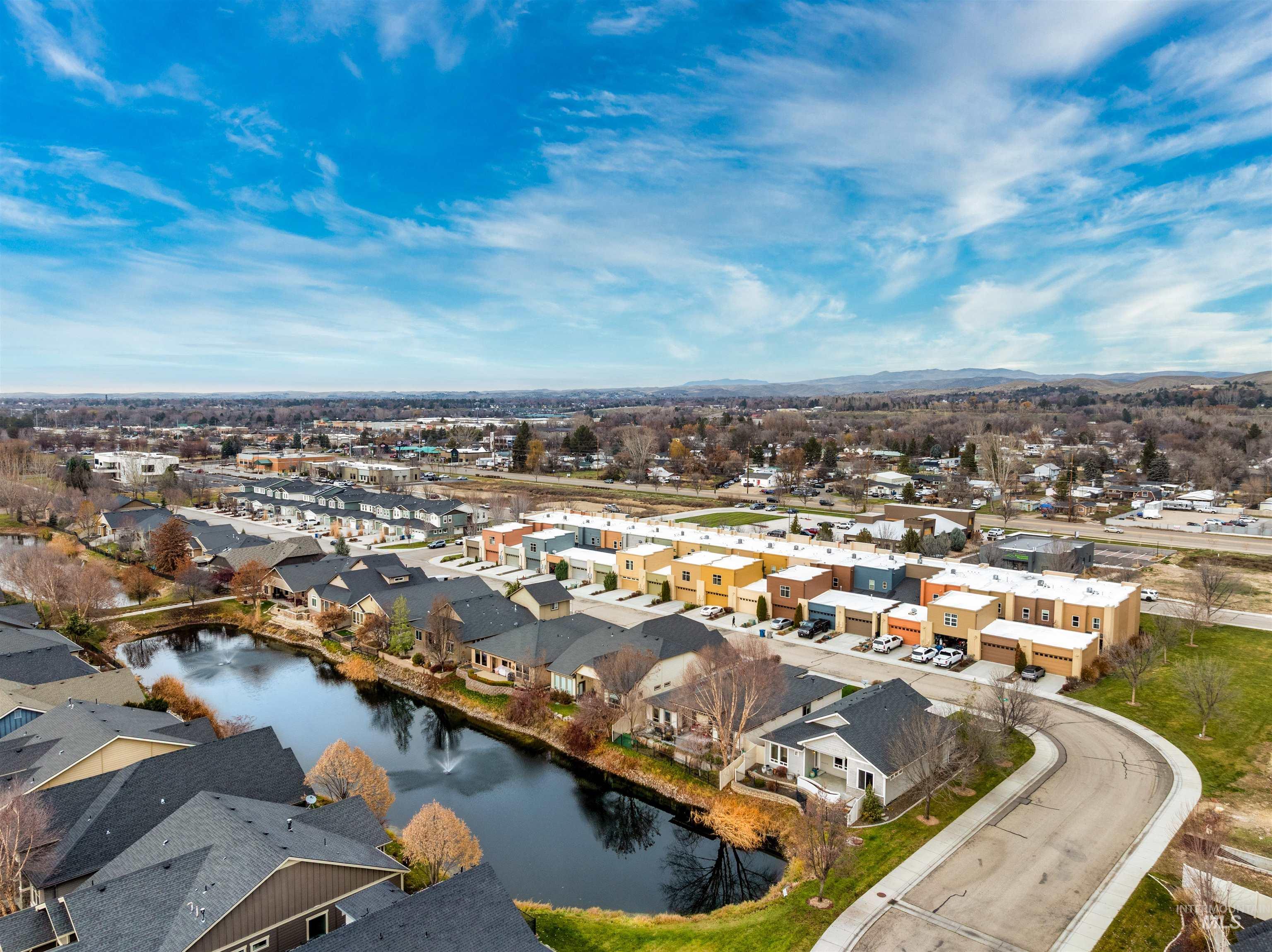 Aerial perspective of suburban area with a large body of water