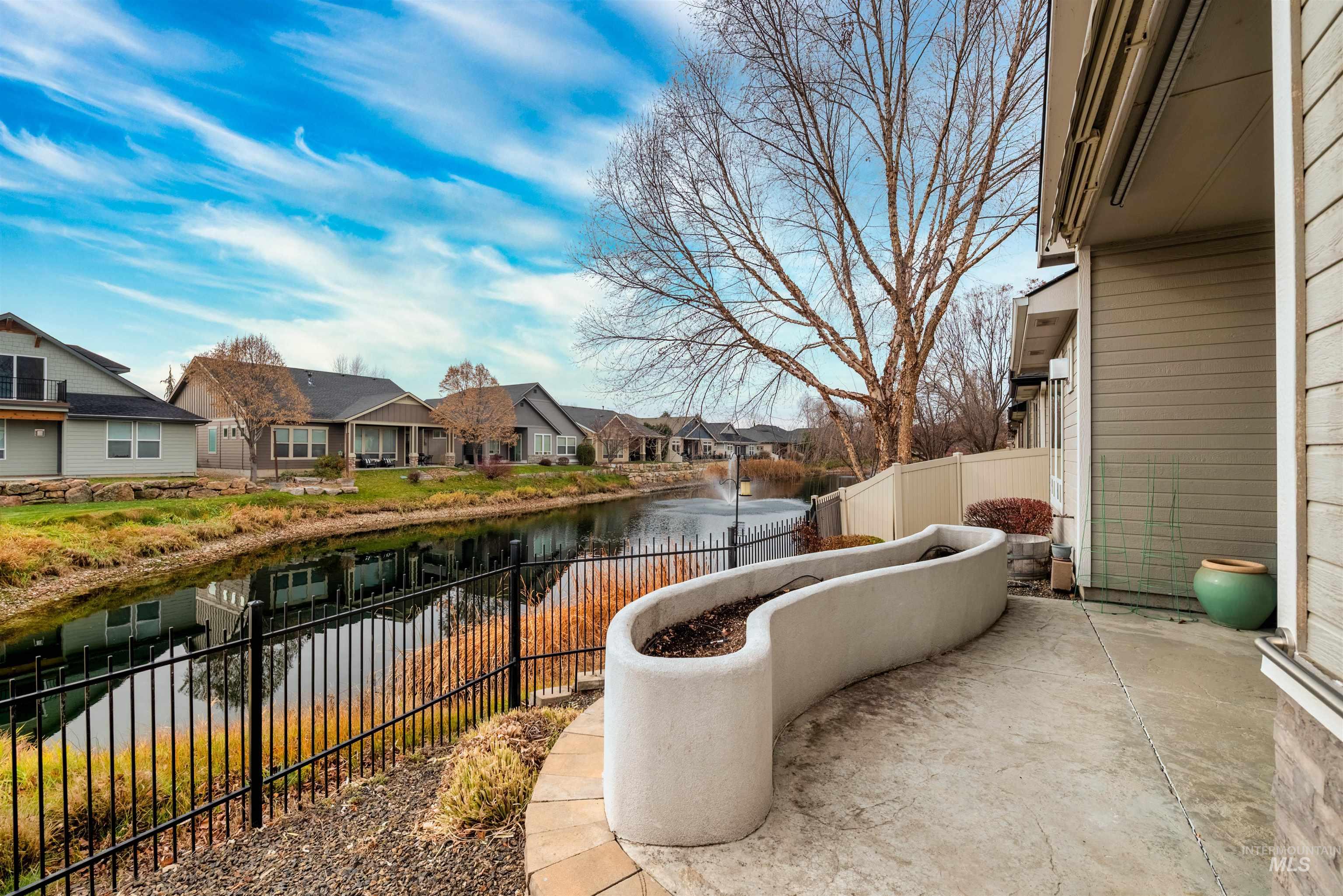 View of patio / terrace featuring a water view and a residential view