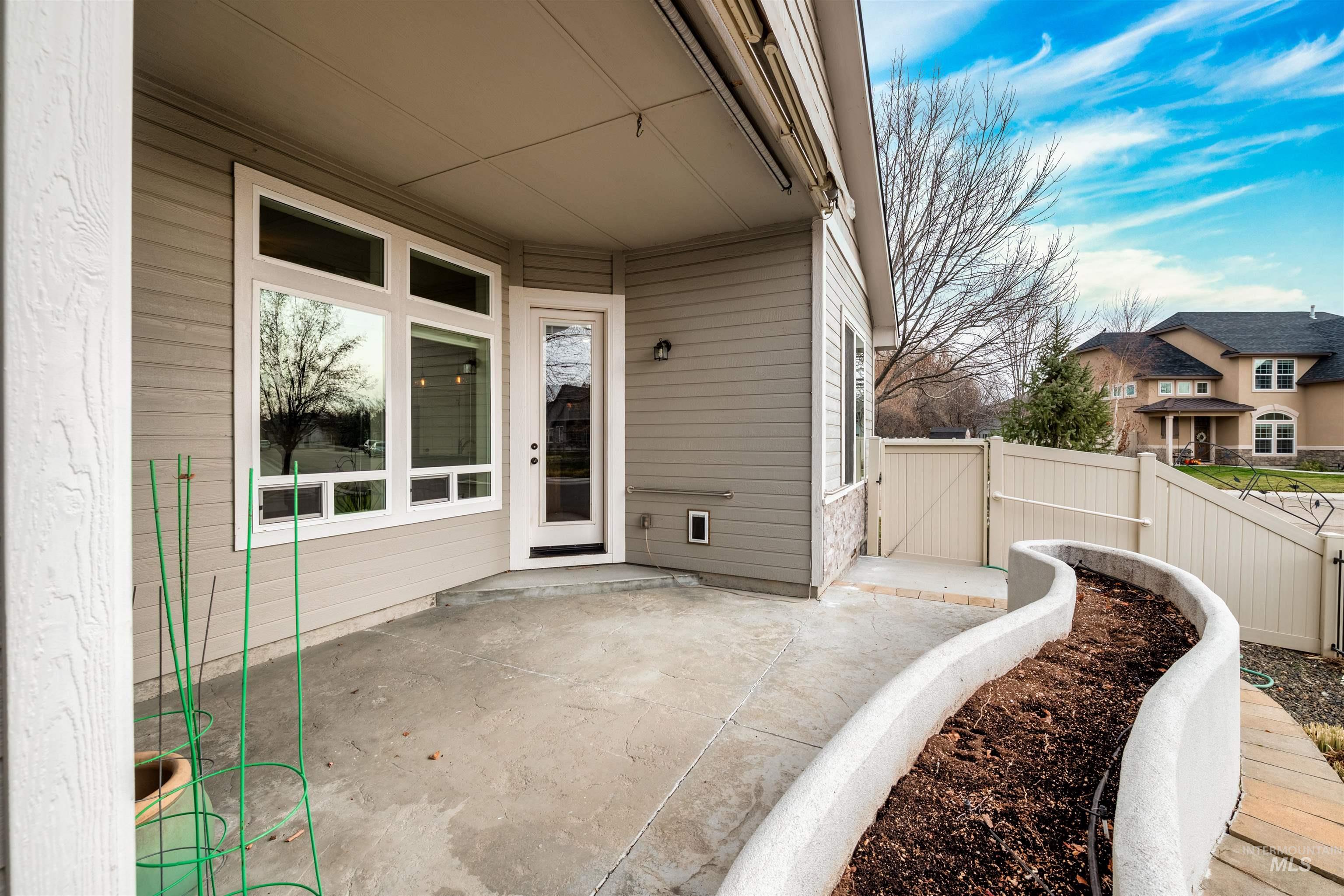 View of patio with a gate