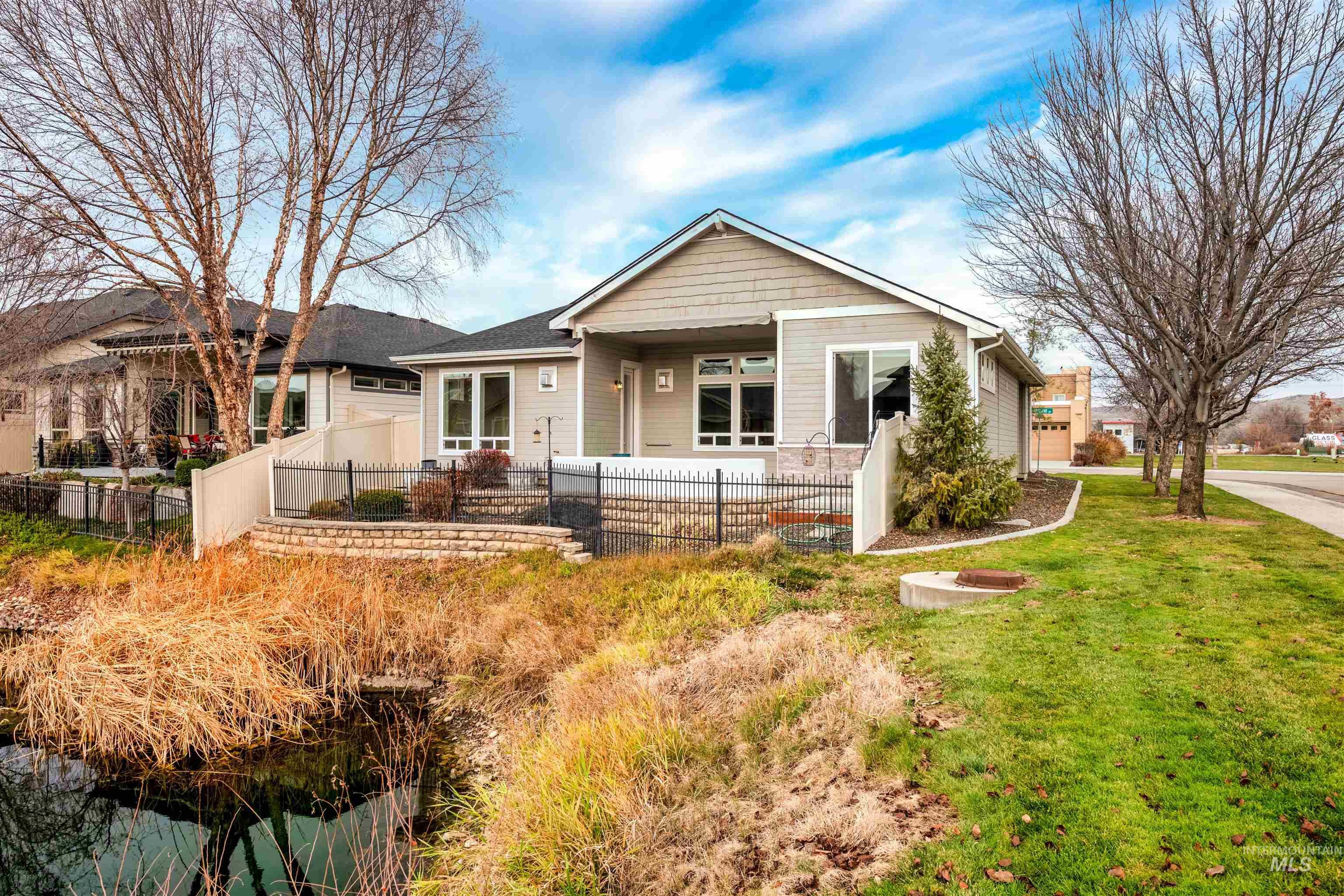 Bungalow-style house featuring a fenced front yard