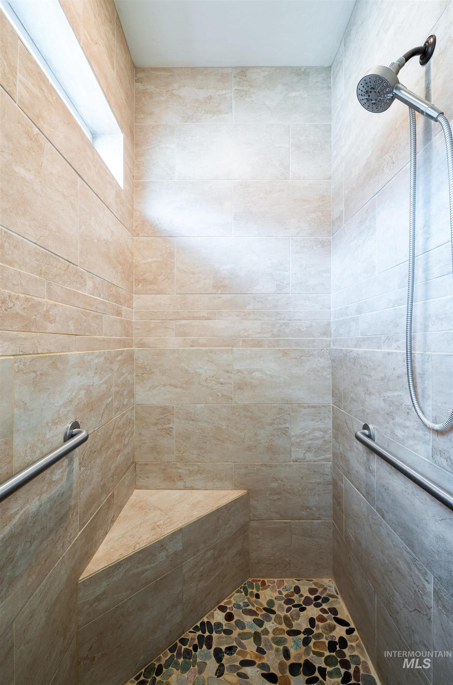 Full bathroom with a tile shower