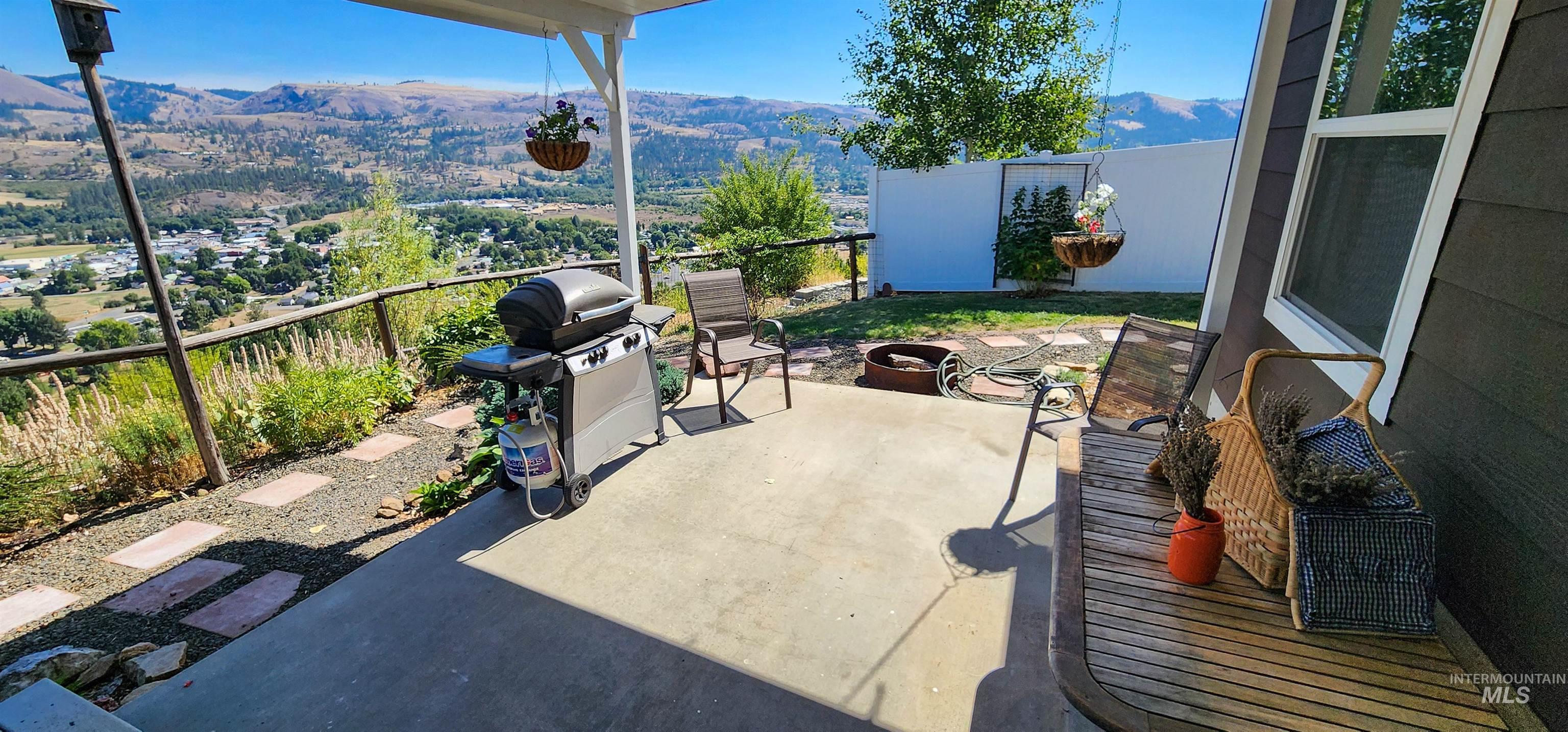 View of patio featuring a mountain view and a grill