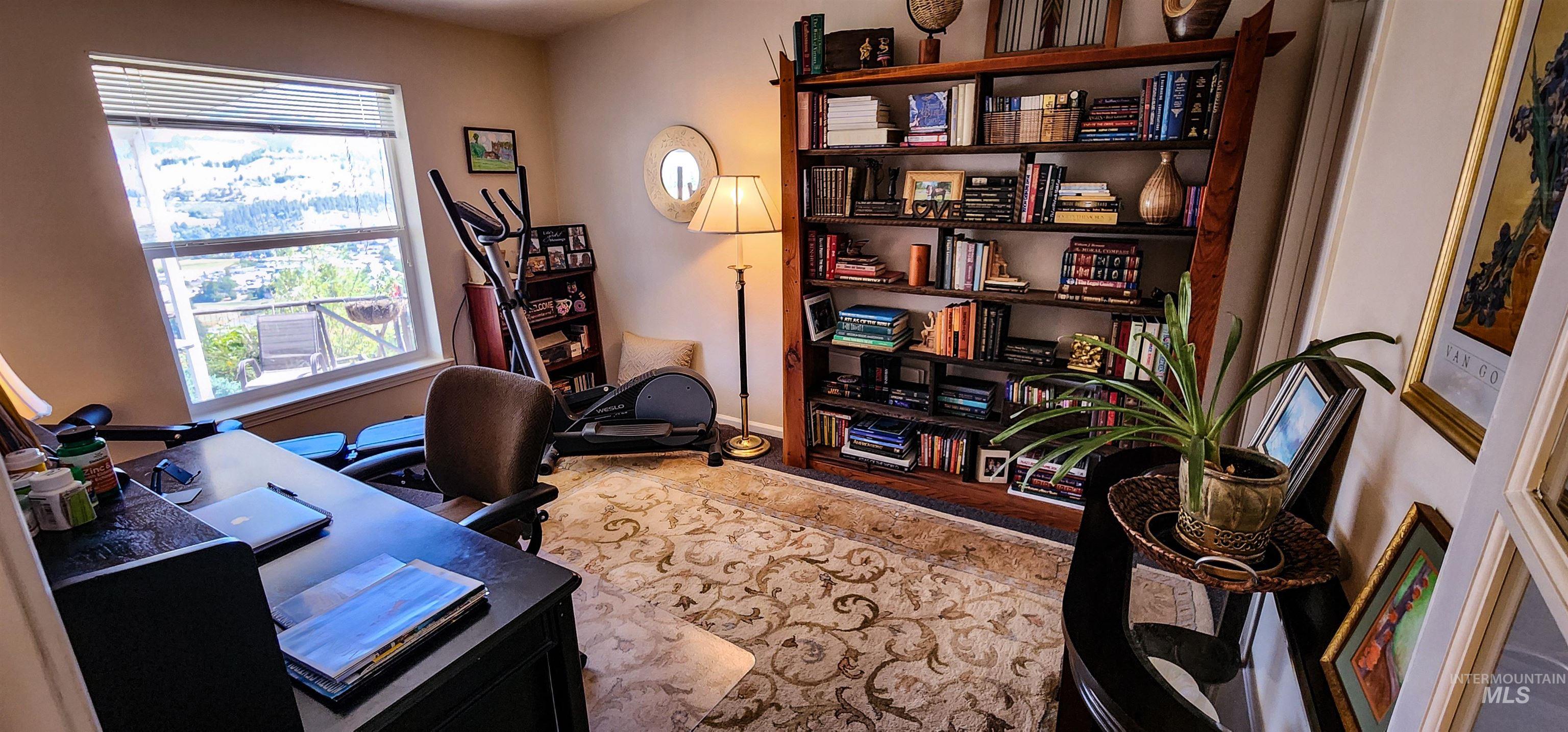 Office area featuring baseboards