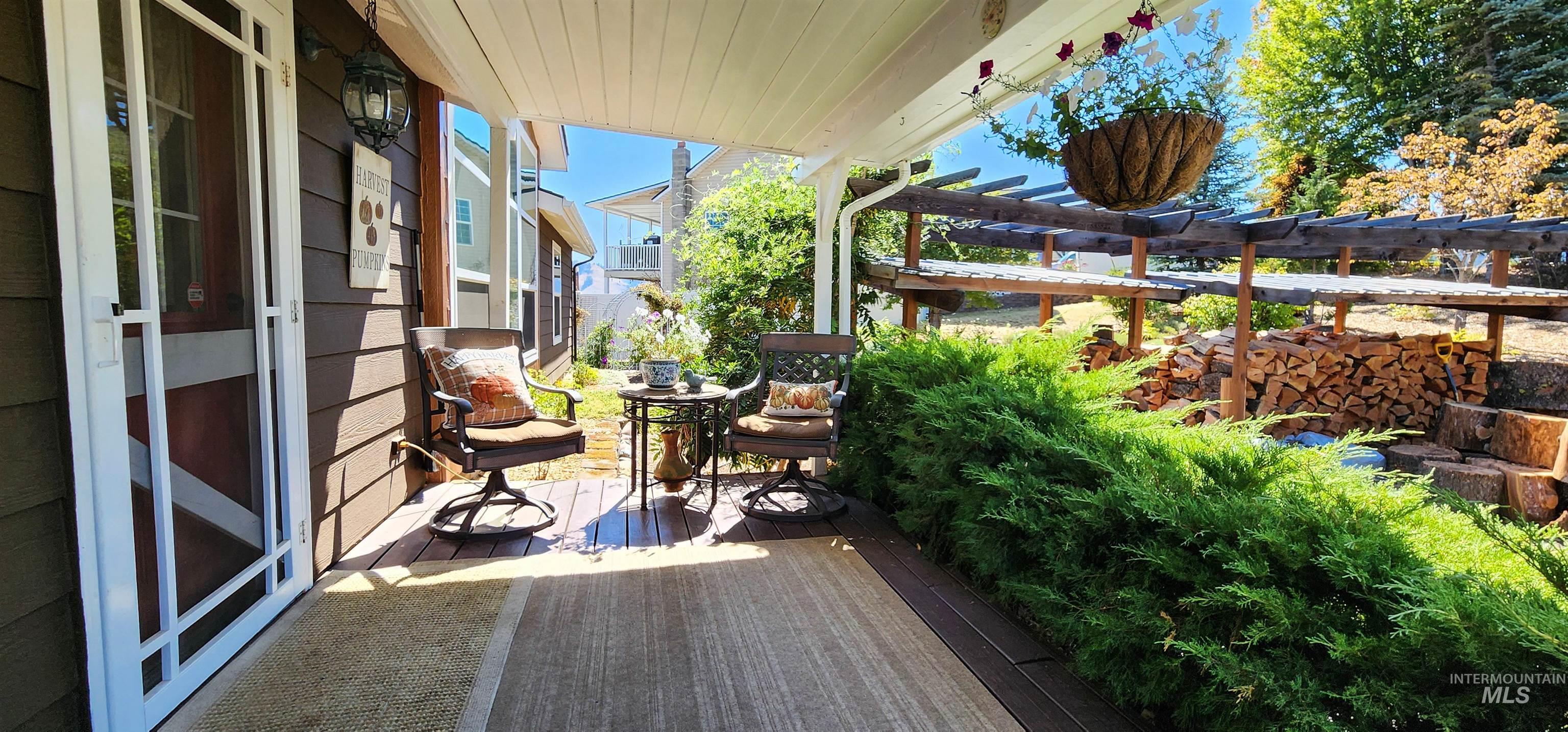 Wooden terrace featuring a pergola