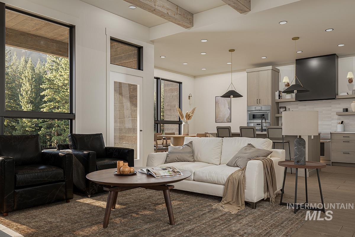 Living room with recessed lighting, wood finished floors, and beamed ceiling