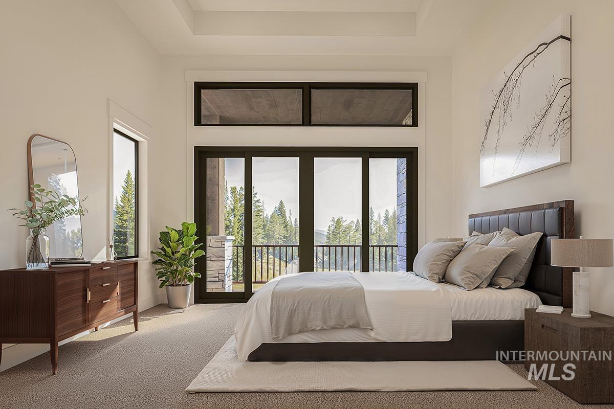 Bedroom featuring carpet flooring, access to outside, and a towering ceiling