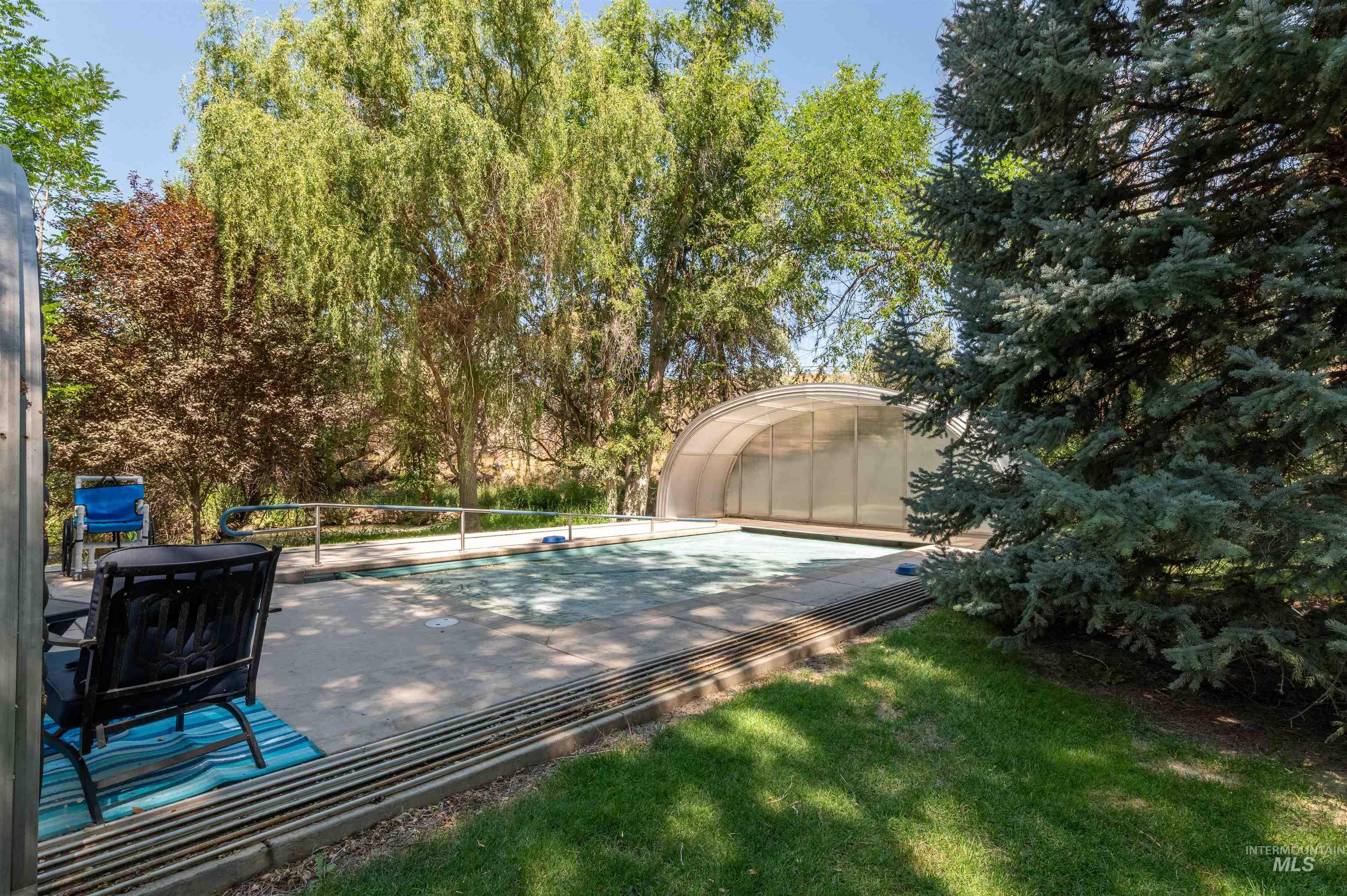 View of swimming pool with an exterior structure