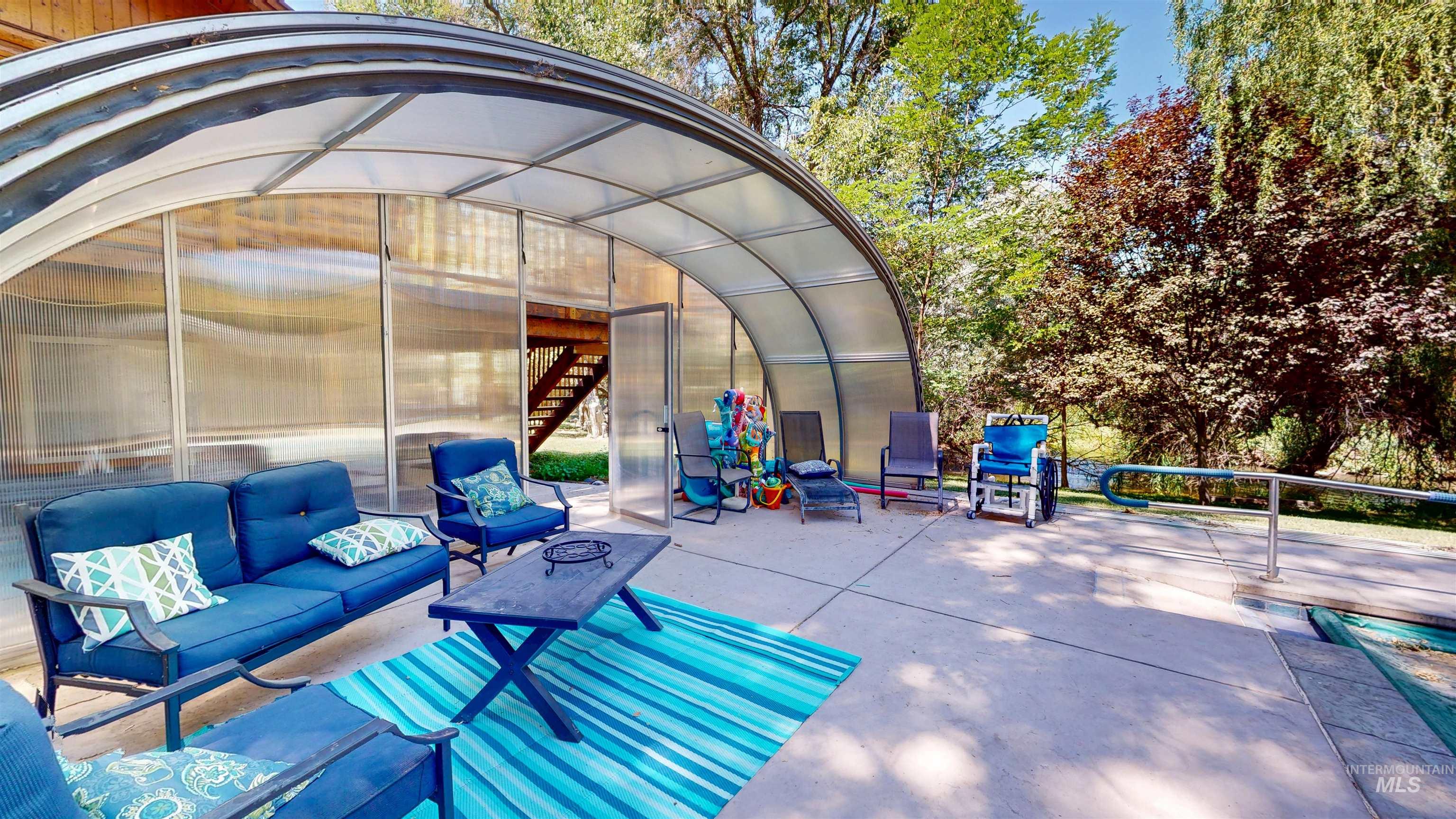 View of patio / terrace featuring an exterior structure and an outdoor living space