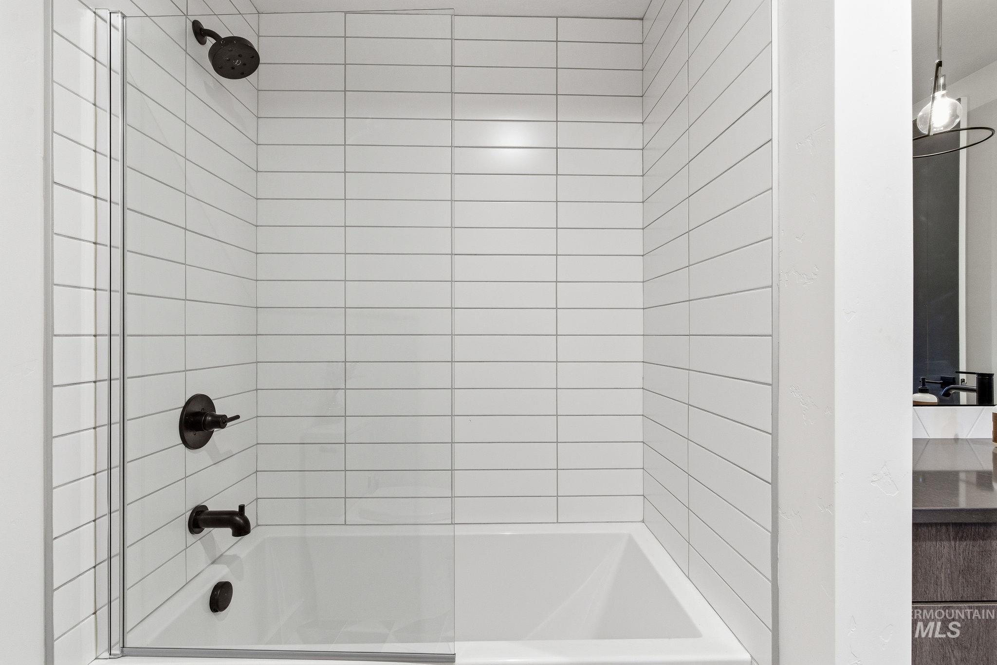 Full bathroom with shower / bathtub combination