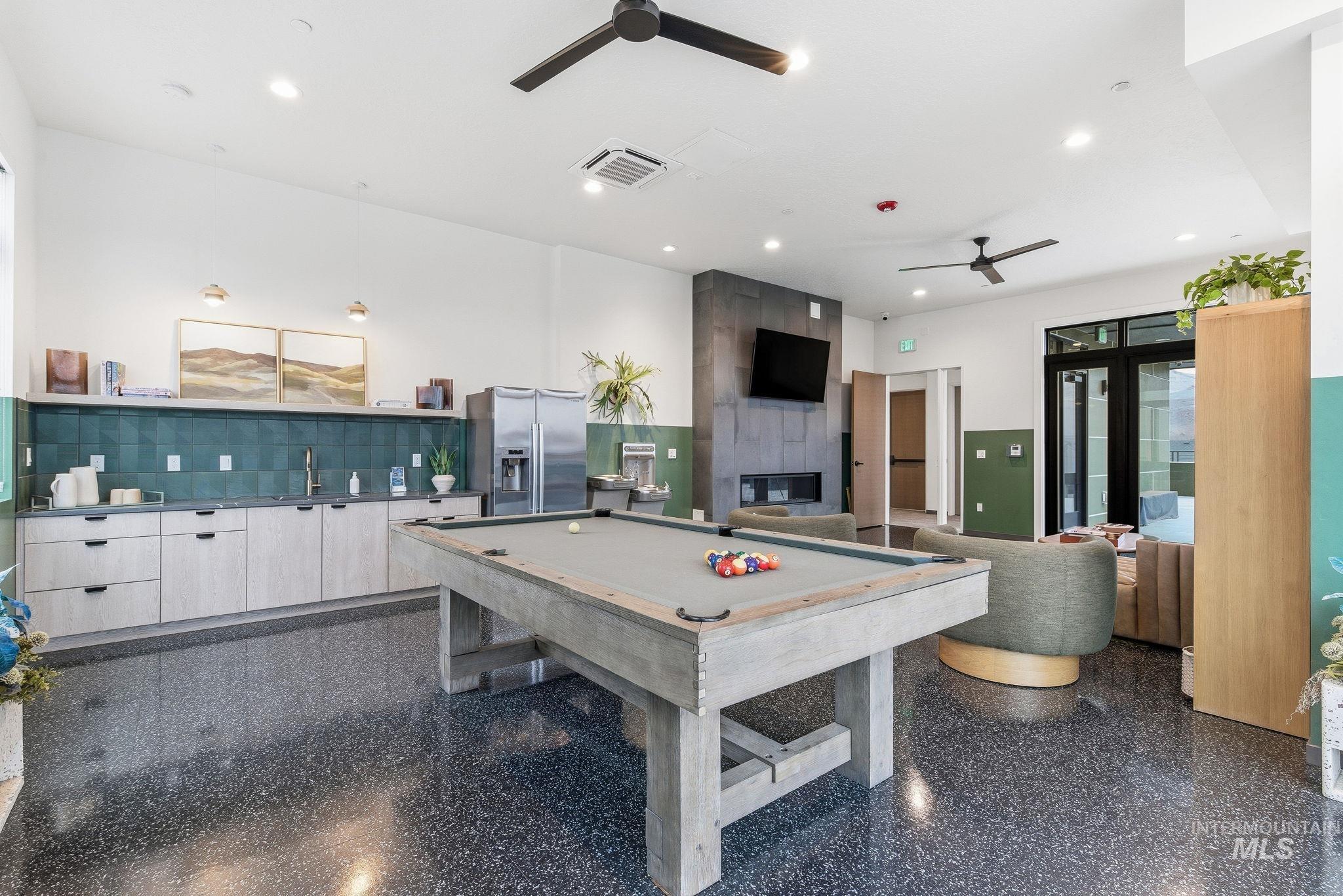 Rec room featuring billiards, ceiling fan, a tile fireplace, and recessed lighting